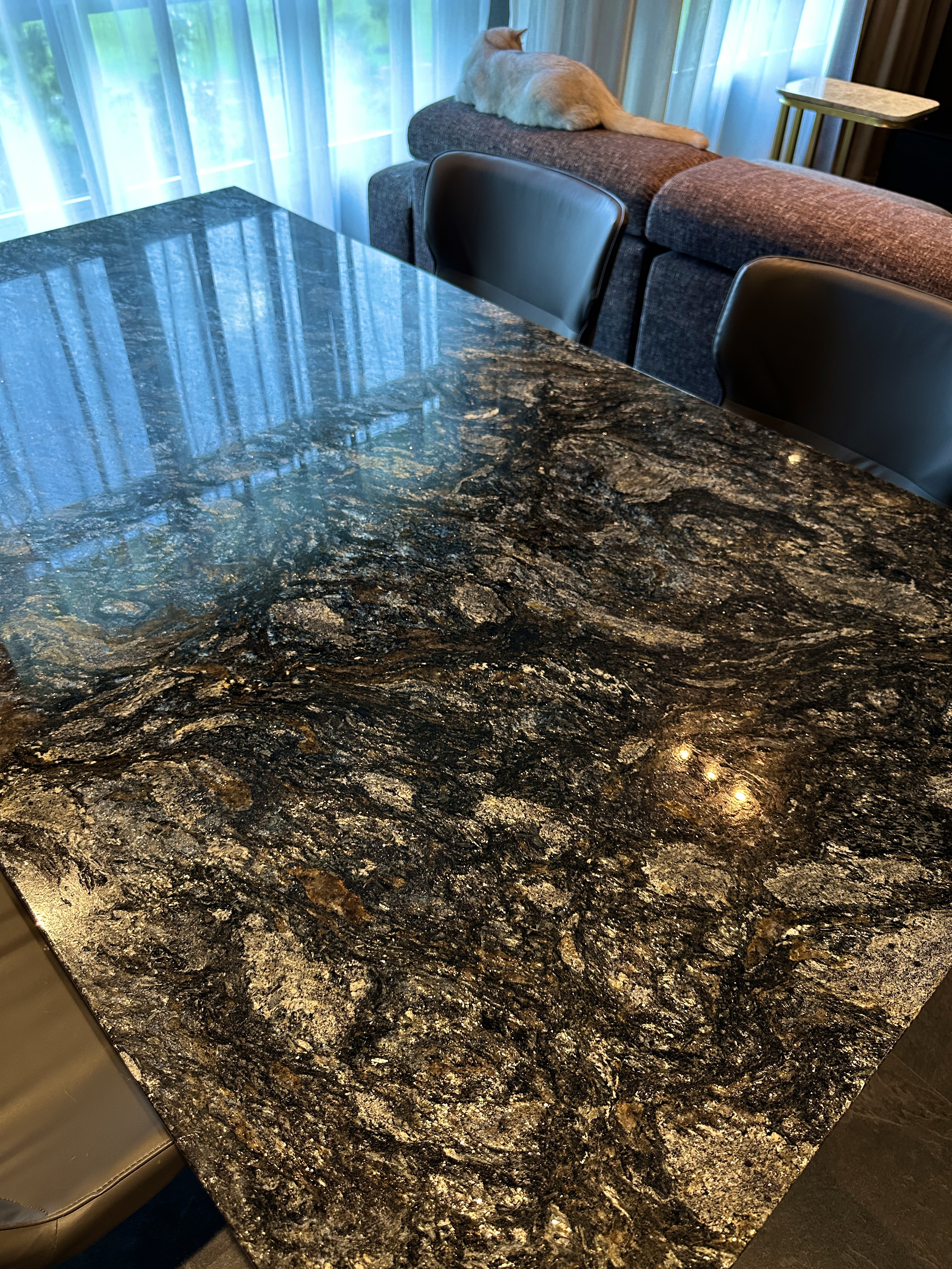 Elegant and Functional: A Glimpse of Our Dark Minimalist Dining Space - Marble countertop, modern dining room, luxurious