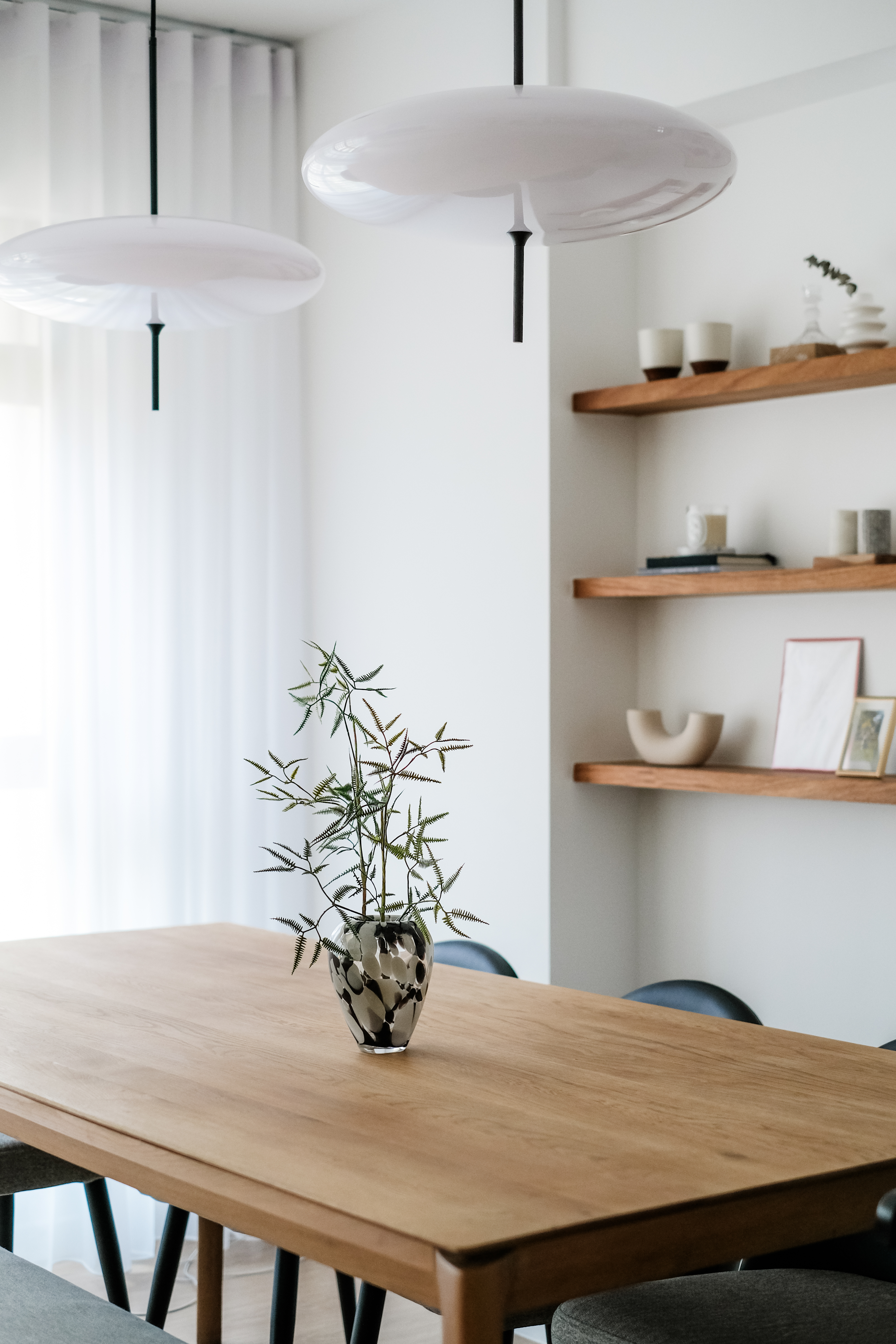 Cozy Modern Dining Room: The Heart of Our Family's Quality Time - Modern minimalist dining room, white pendant lights, sleek
