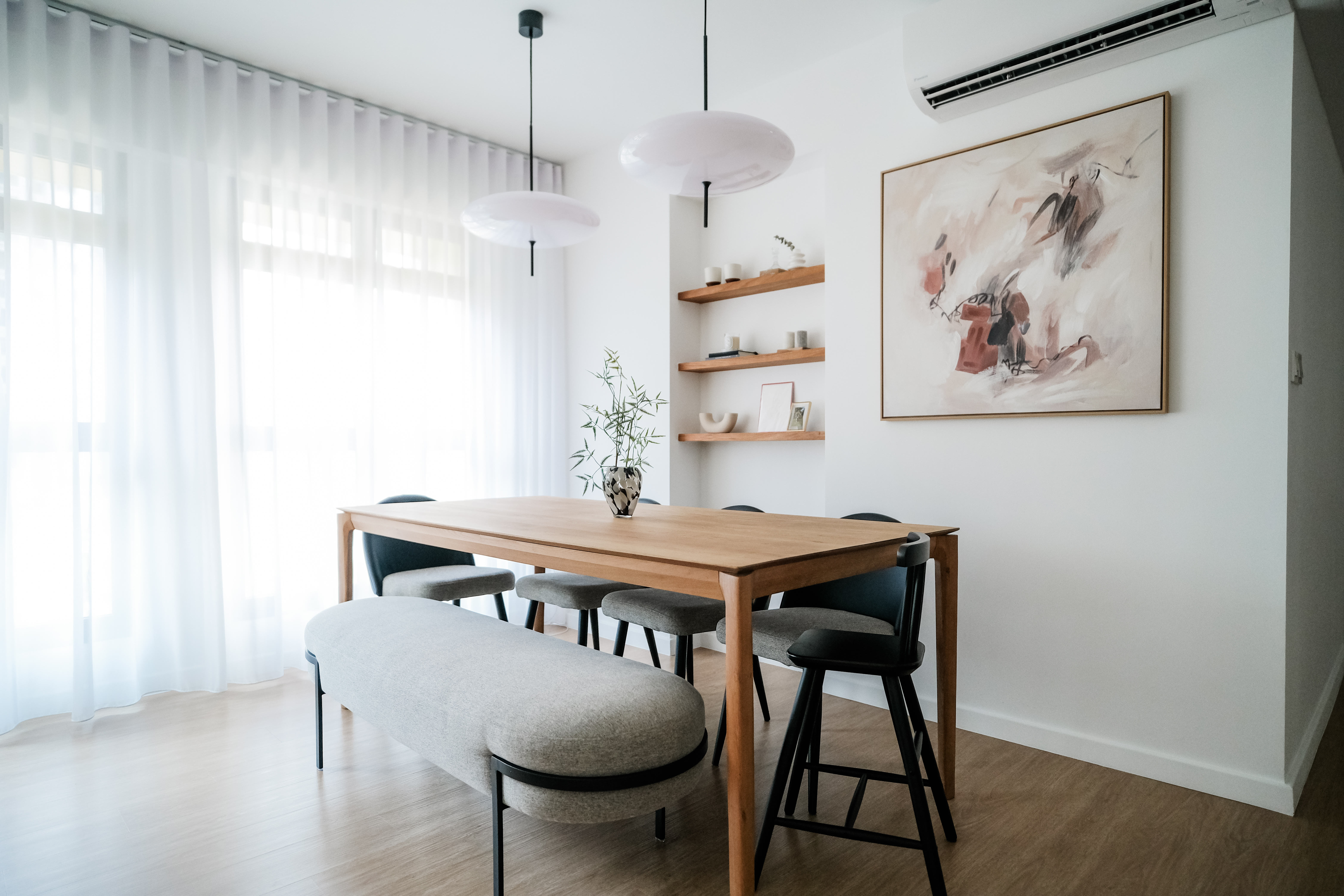 Cozy Modern Dining Room: The Heart of Our Family's Quality Time - Modern dining room with wooden table and black chairs