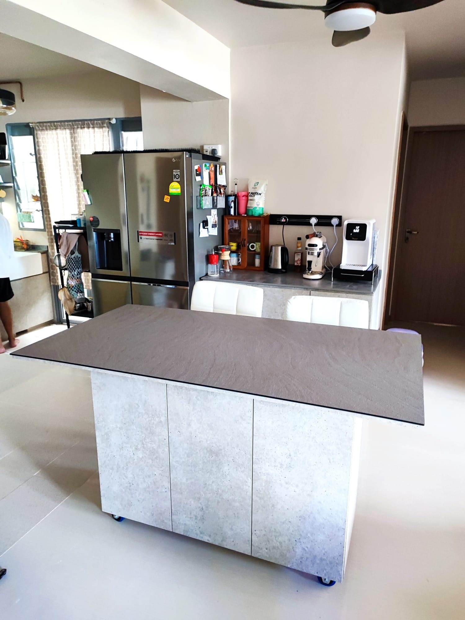 A multifunctional dining area, but on wheels! - modern kitchen, stainless steel refrigerator, kitchen island, white cabinets