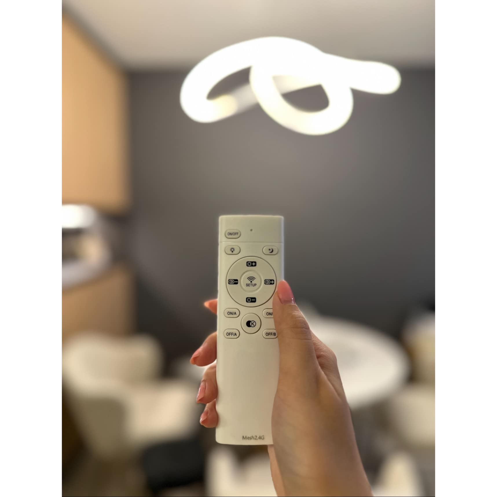 Dining In Style, Where Elegance Meets Comfort  - White remote control with multiple buttons, Indoor setting with modern