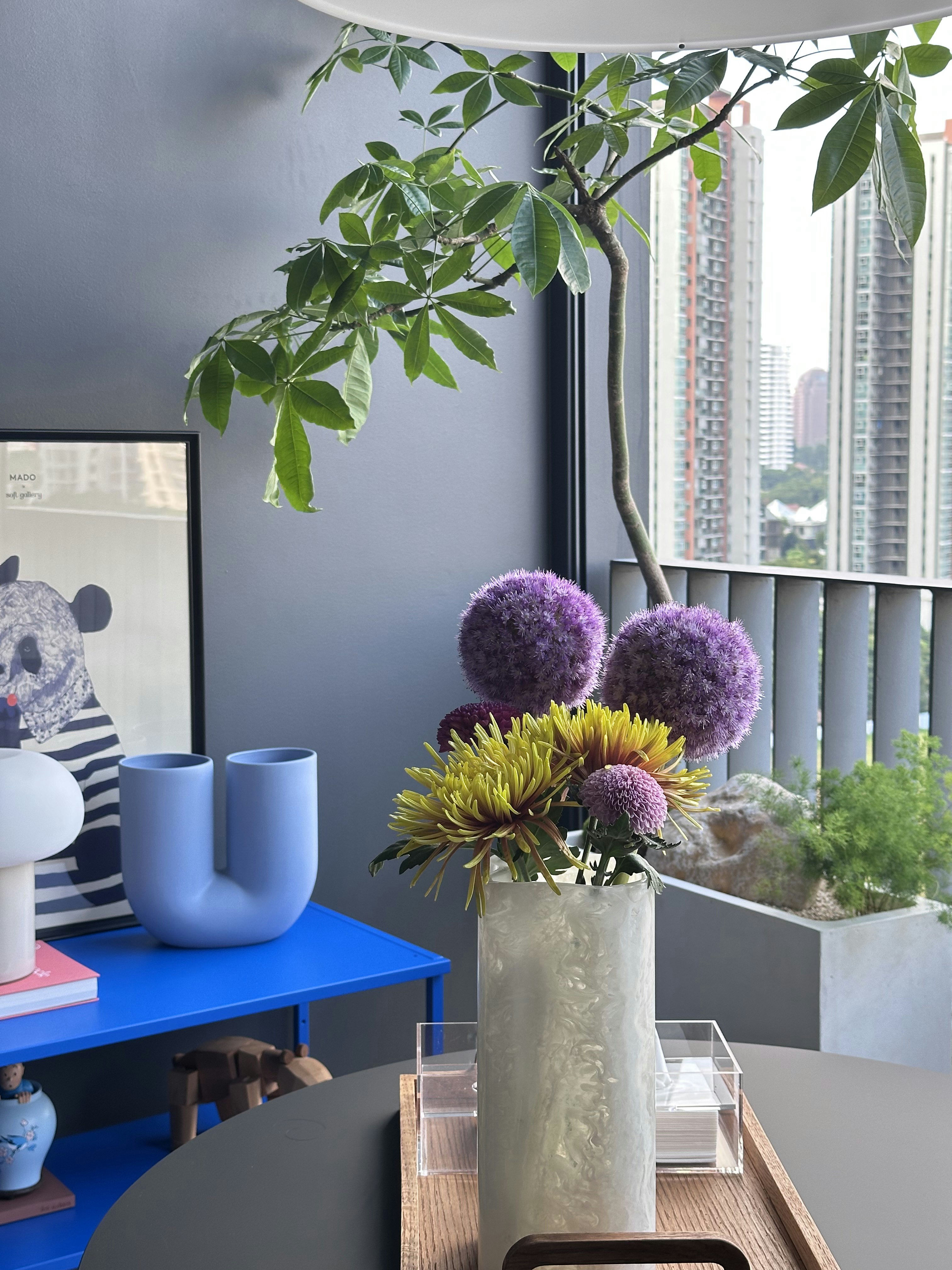 Our Dining Space: Alfresco Dining with Unblocked City View - vibrant indoor setting, modern decor, colorful flowers, indoor