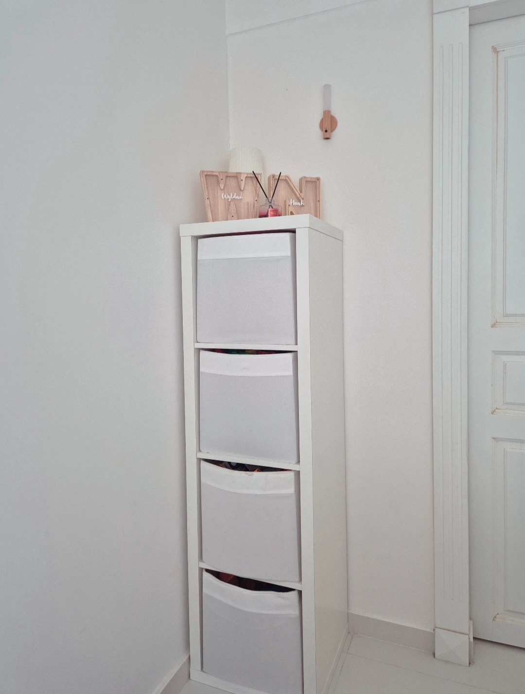 Hosting tips by punggoHField - White storage unit, minimalist design, built-in drawers, floating shelves, organized storage