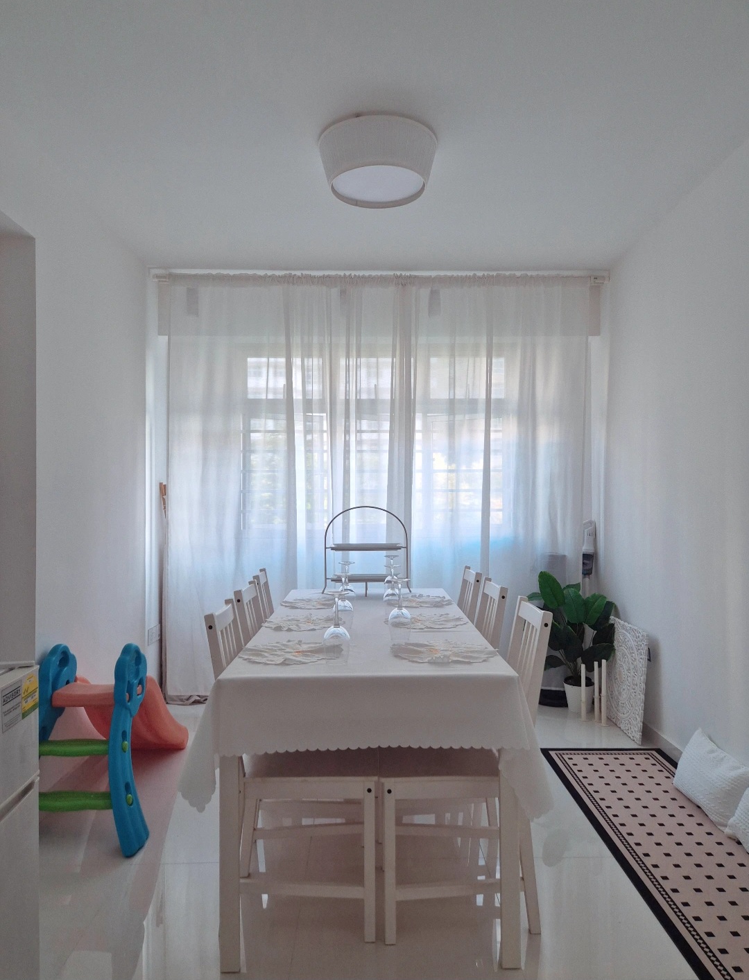 Hosting tips by punggoHField - White dining room, minimalist design, bright ambiance, large window, sheer curtains, dining