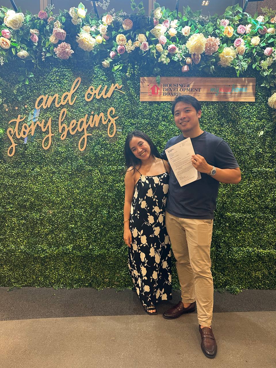Finding a House and Making a Home - Floral backdrop, Couple posing, "and our story beginning" sign, Greenery and flowers, Man