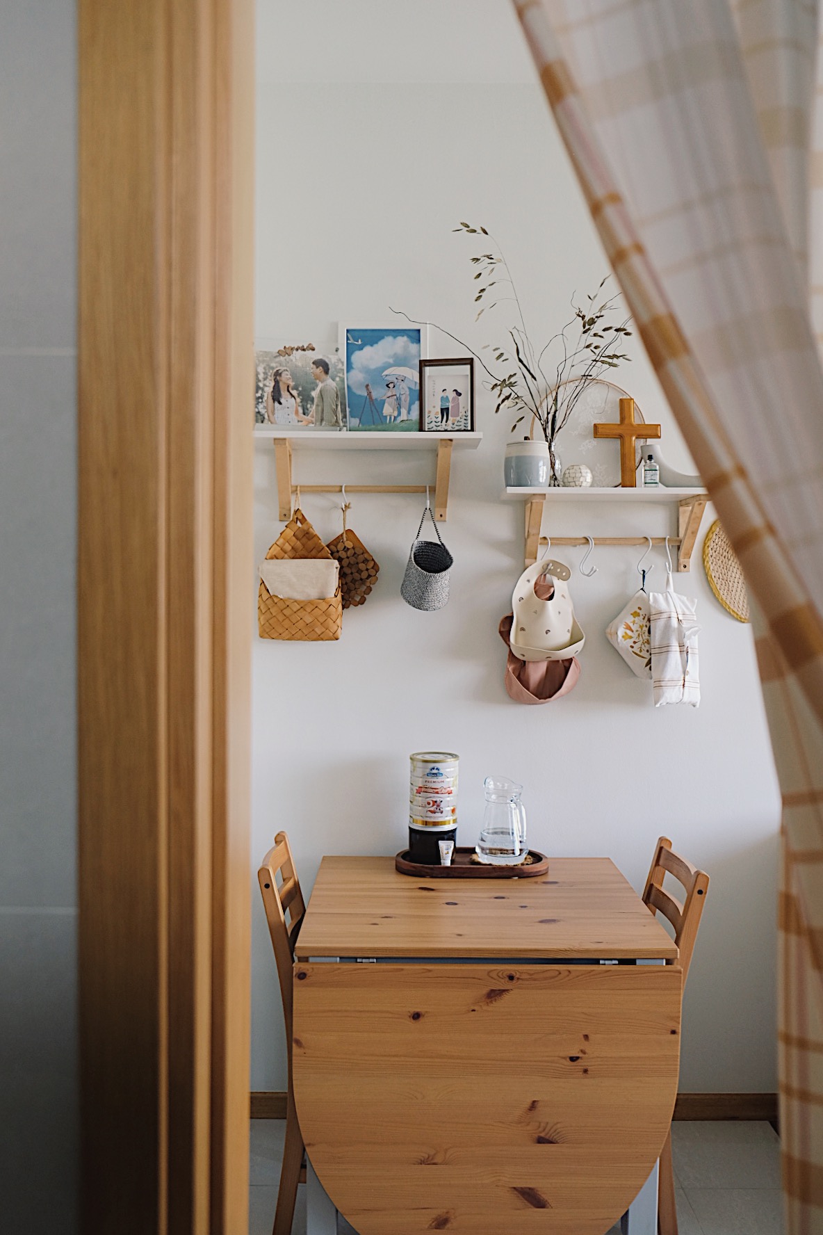 Styling a cosy dining nook in a small home - Wooden dining table, minimalist decor, cozy room, natural light, wooden chairs