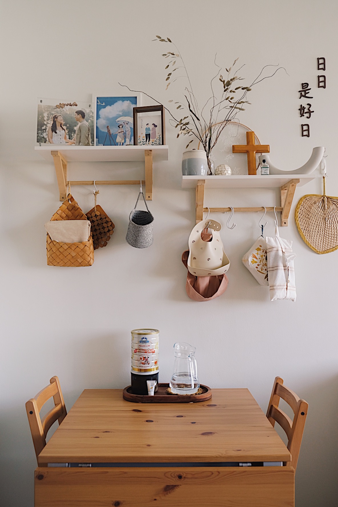 Styling a cosy dining nook in a small home - Wooden dining table, minimalist decor, natural light, wooden chairs, rustic