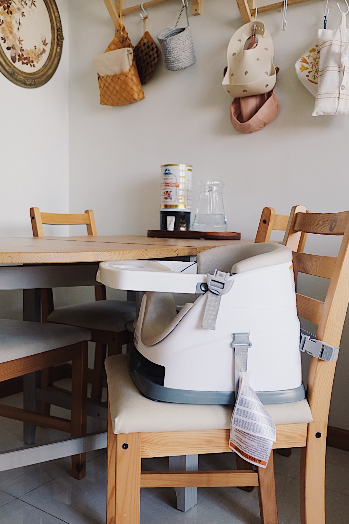 Styling a cosy dining nook in a small home - Wooden dining table, baby car seat, wooden chairs, kitchen setting, hanging