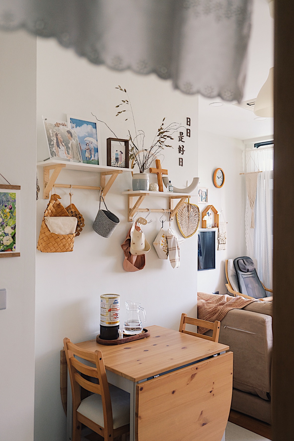 Styling a cosy dining nook in a small home - Wooden dining table, minimalist decor, cozy room, natural light, wooden chairs