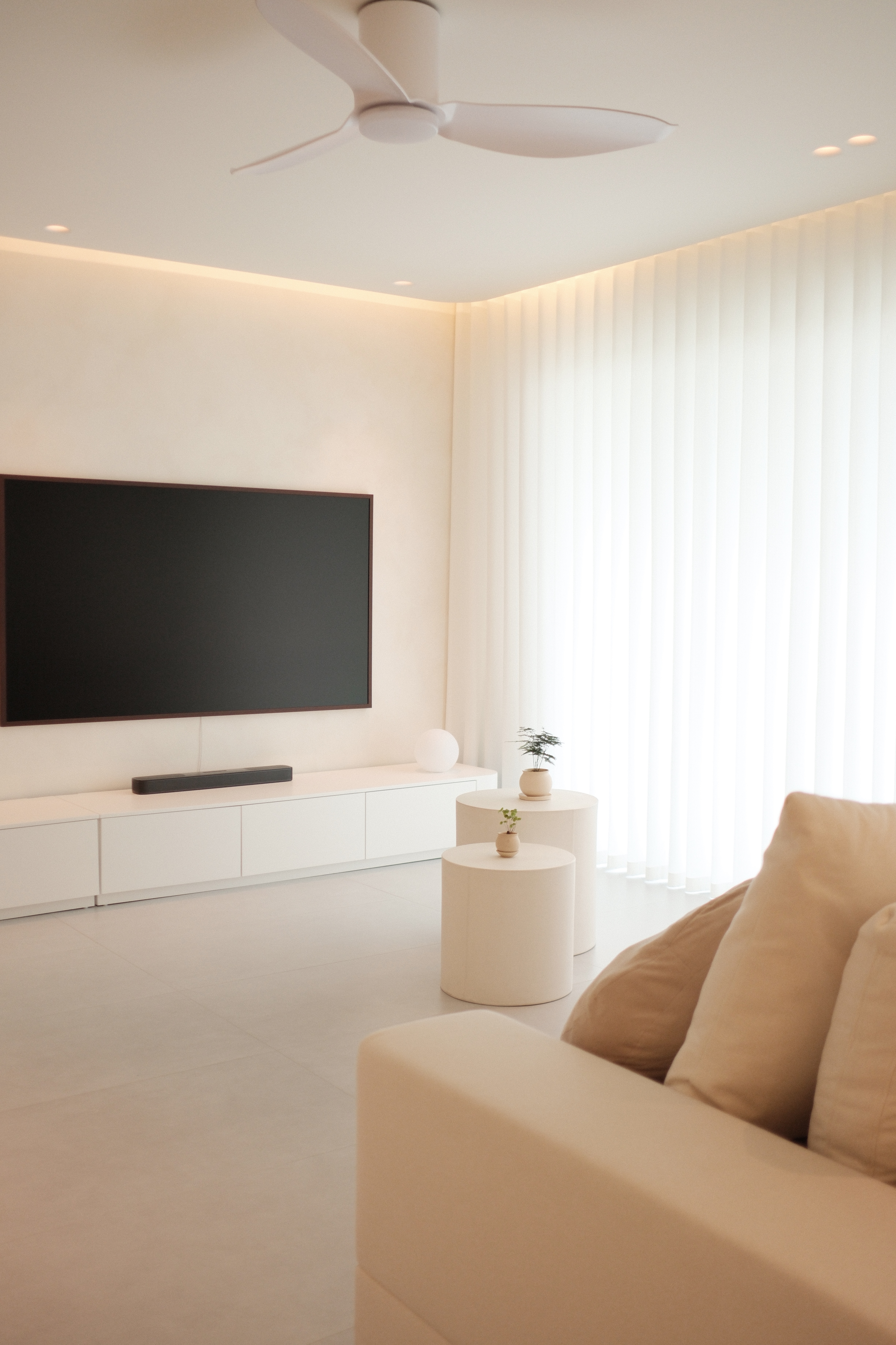 Our Living Room: Go Cream Or Go Home - Large flat-screen TV, minimalist decor, modern living room, white cabinets