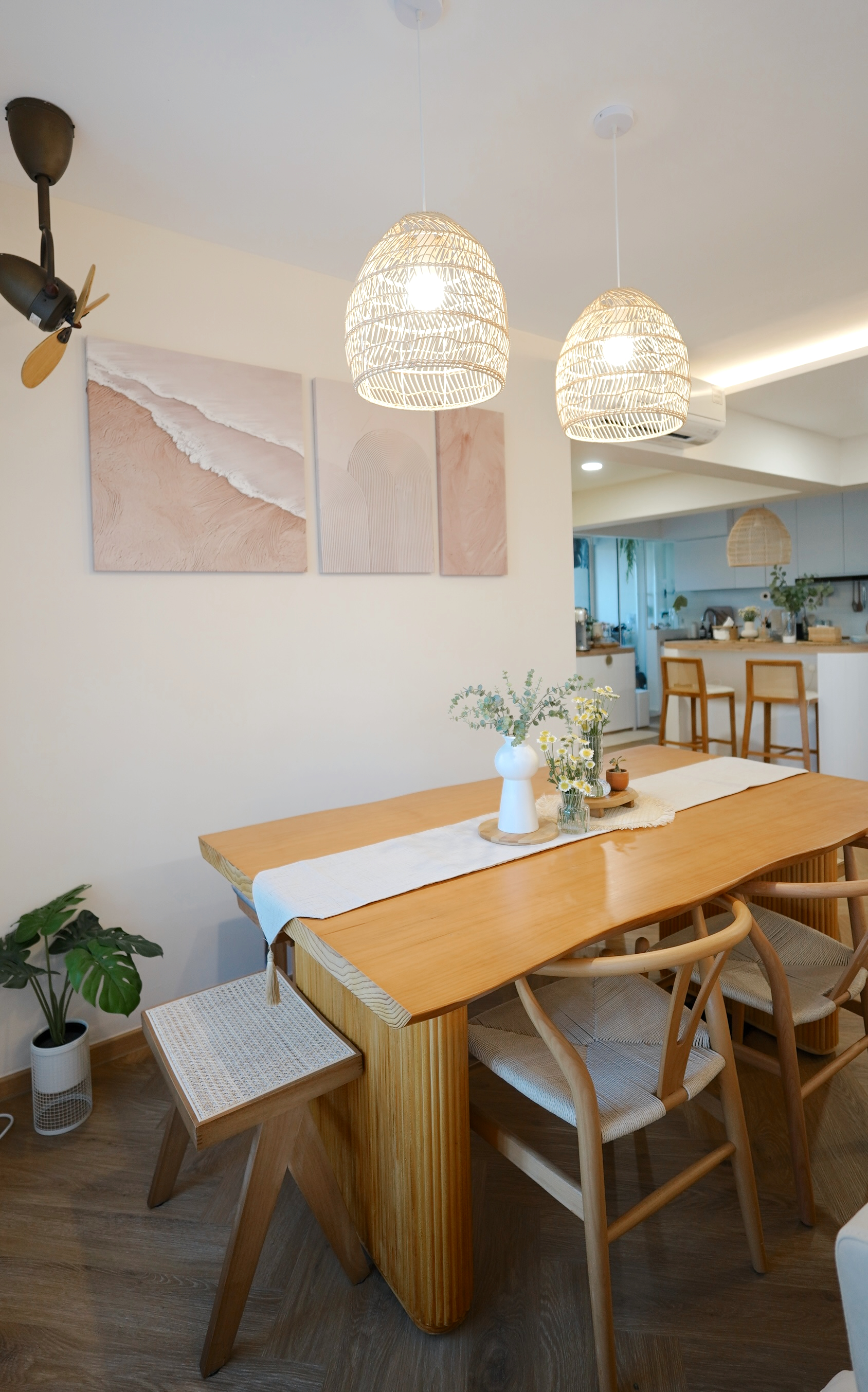 Communal dining space - Calming vibes with a touch of modern farmhouse - Wooden dining table with white placemat, modern
