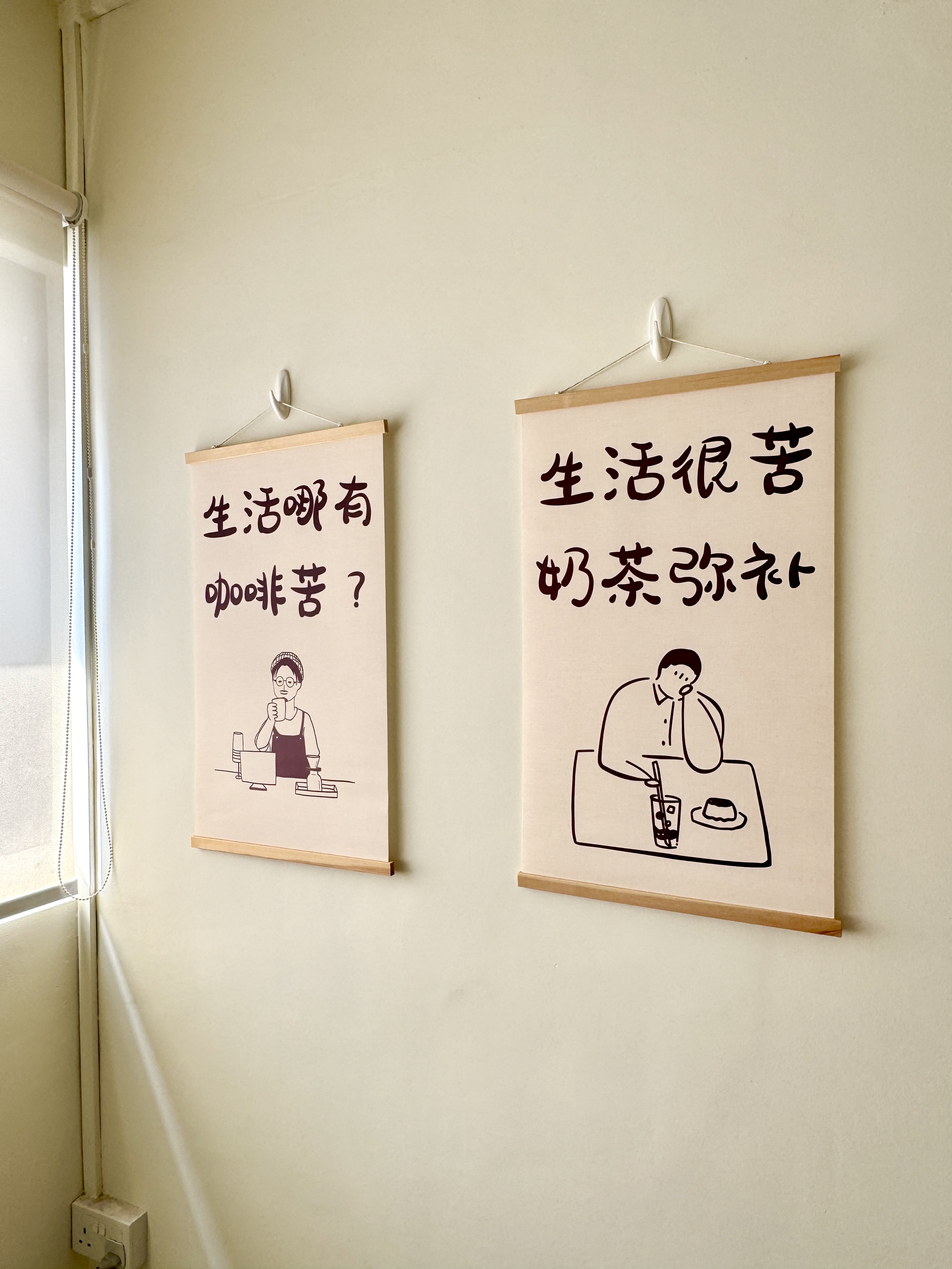 Furnishing our Dining Area for under $250 - Two hanging posters on a light beige wall, Chinese characters on beige paper, Two