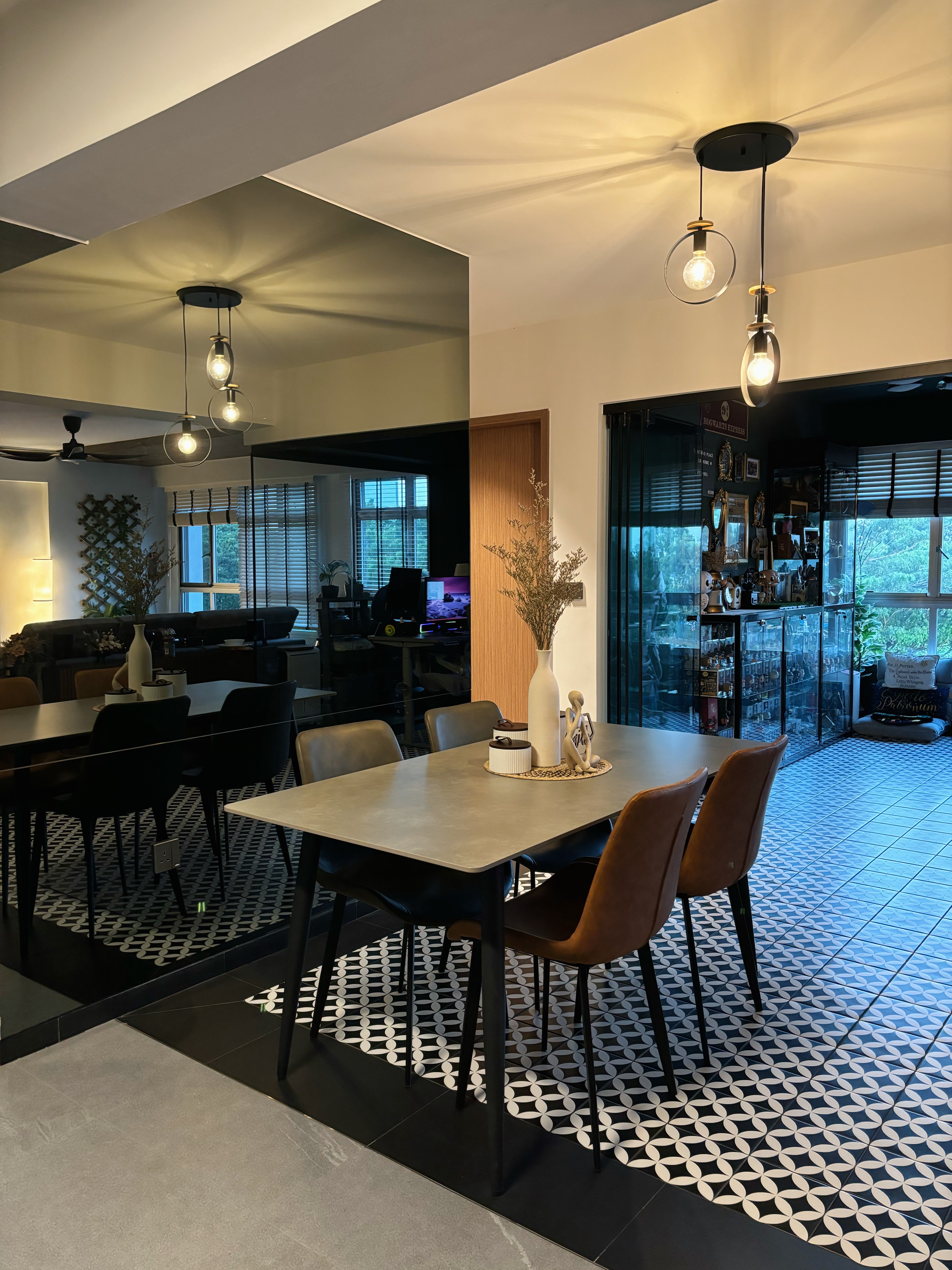 Meal and Greet - Modern dining room with sleek furniture, geometric patterned floor tiles, contemporary pendant lights, black