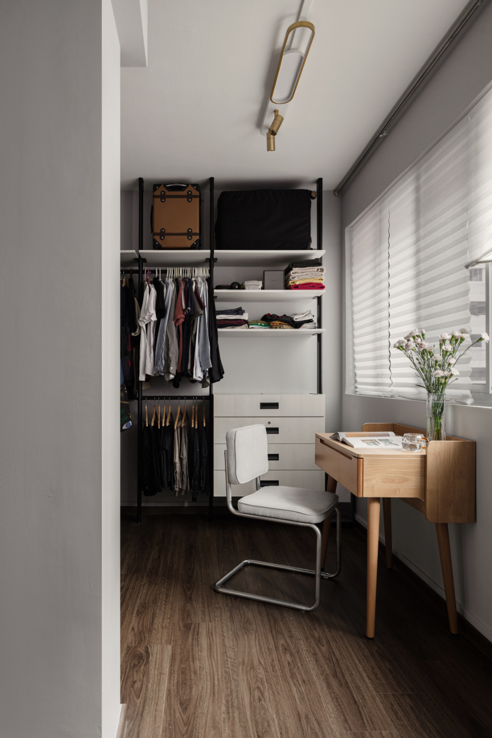 How we saved over 3.5k on furnishing our home - Modern wardrobe with open shelves, neatly organized clothes, black suitcase