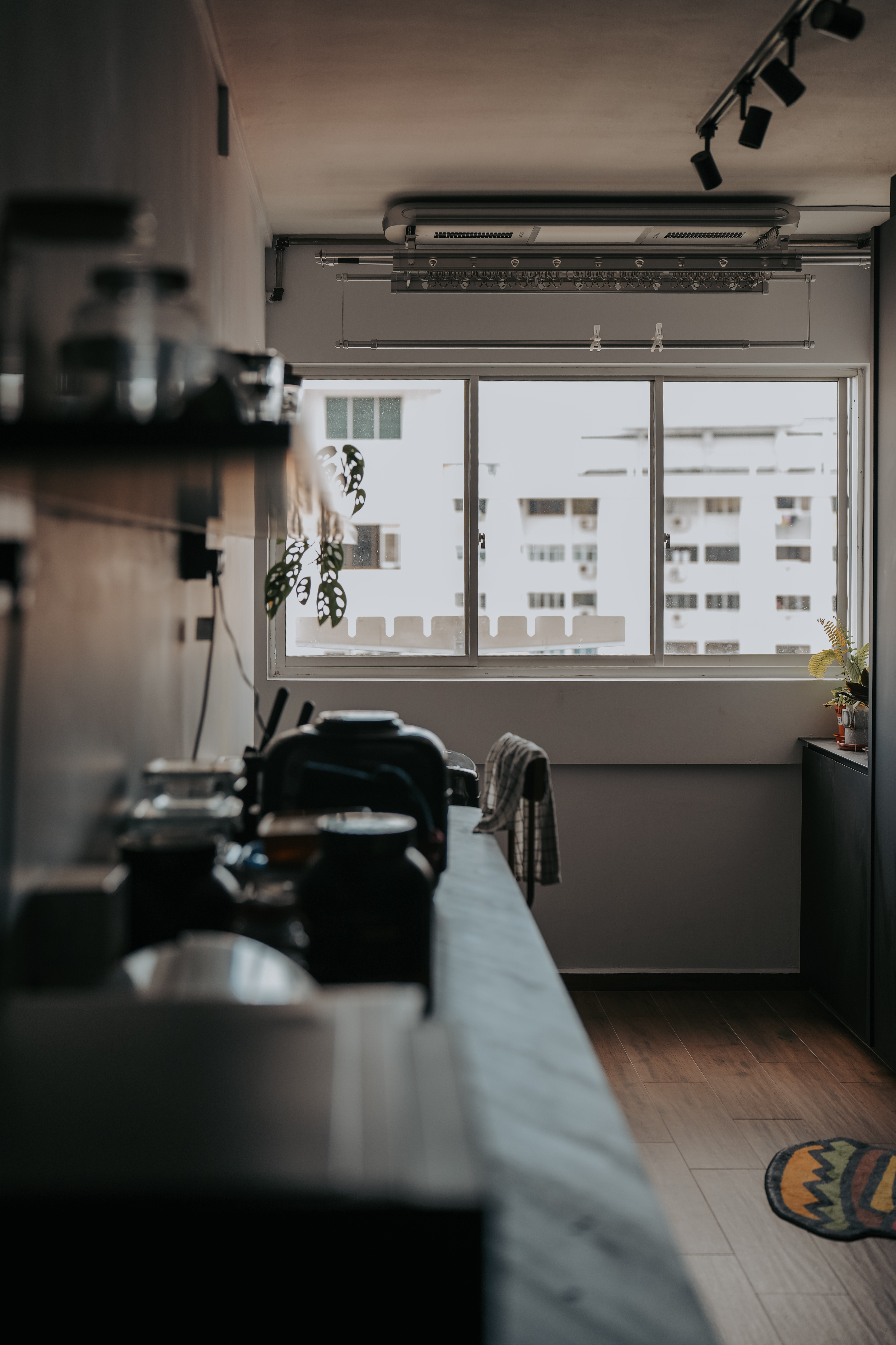 Take a walk in our modern, dark humble 4-room abode! - Modern kitchen with large windows, minimalist design, natural light