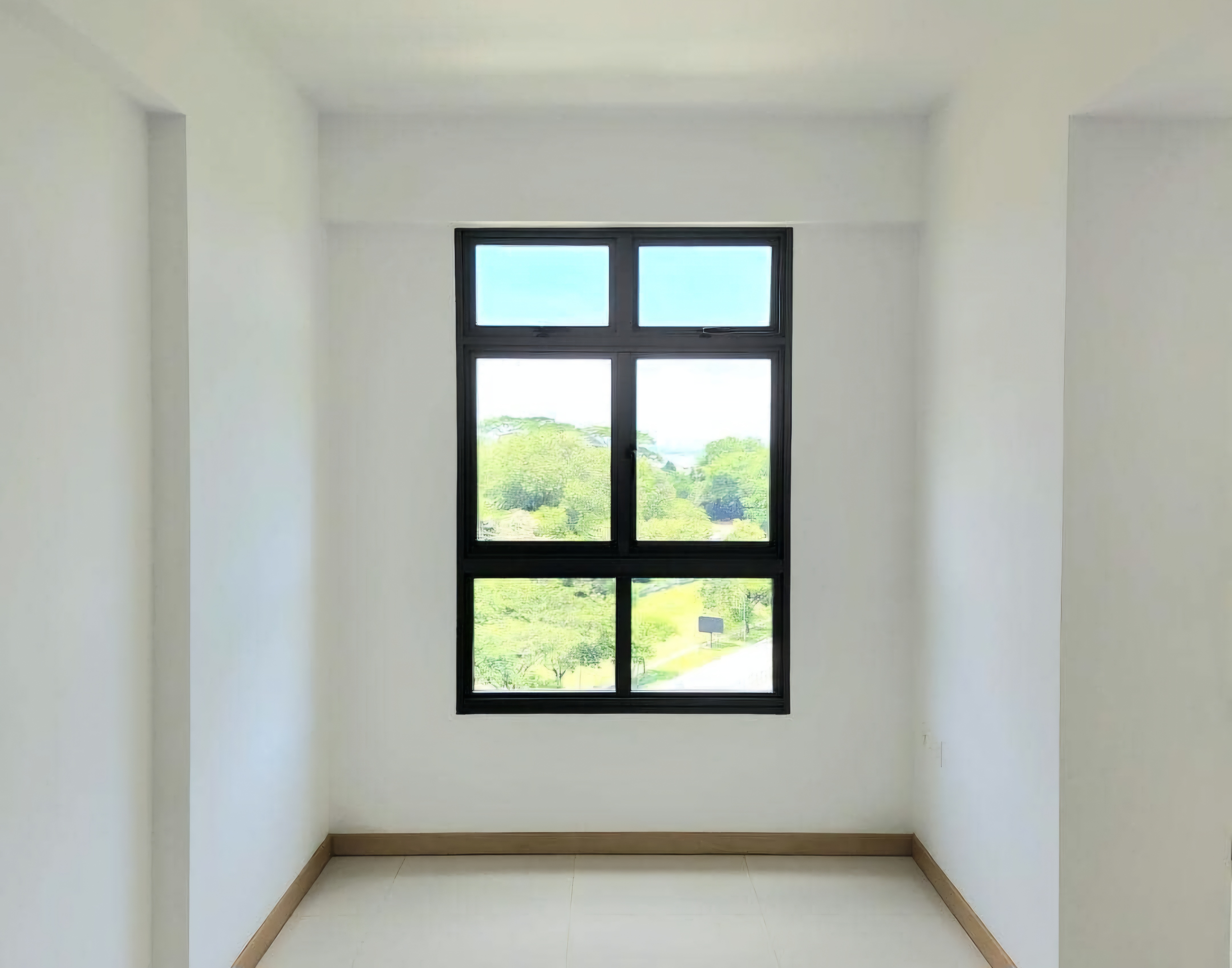 Renders vs. Reality: A Visual Journey - White walls, bright window, green foliage outside, wooden floor, minimalist design