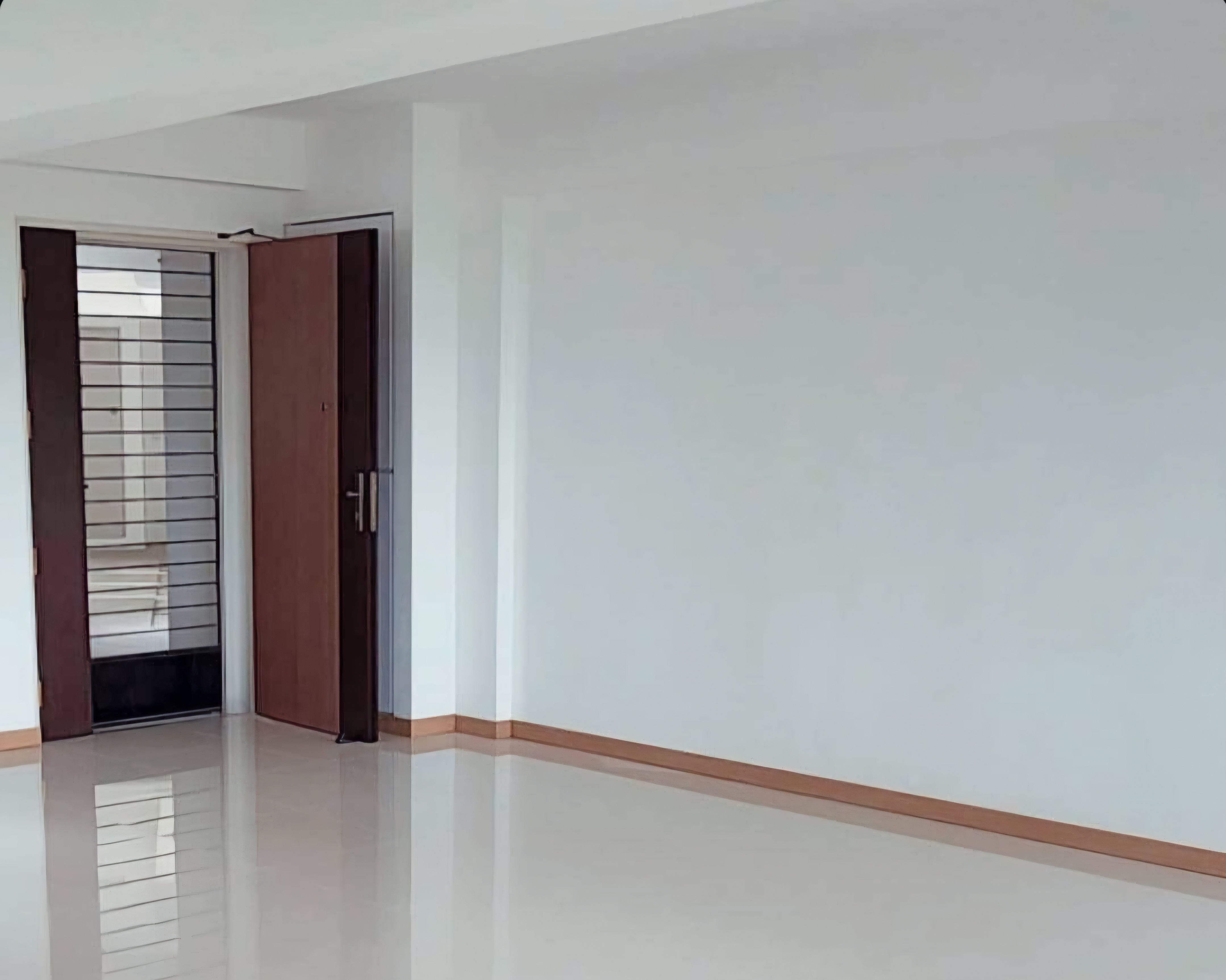 Renders vs. Reality: A Visual Journey - Modern minimalist interior, clean white walls, wooden trim, reflective floor, open