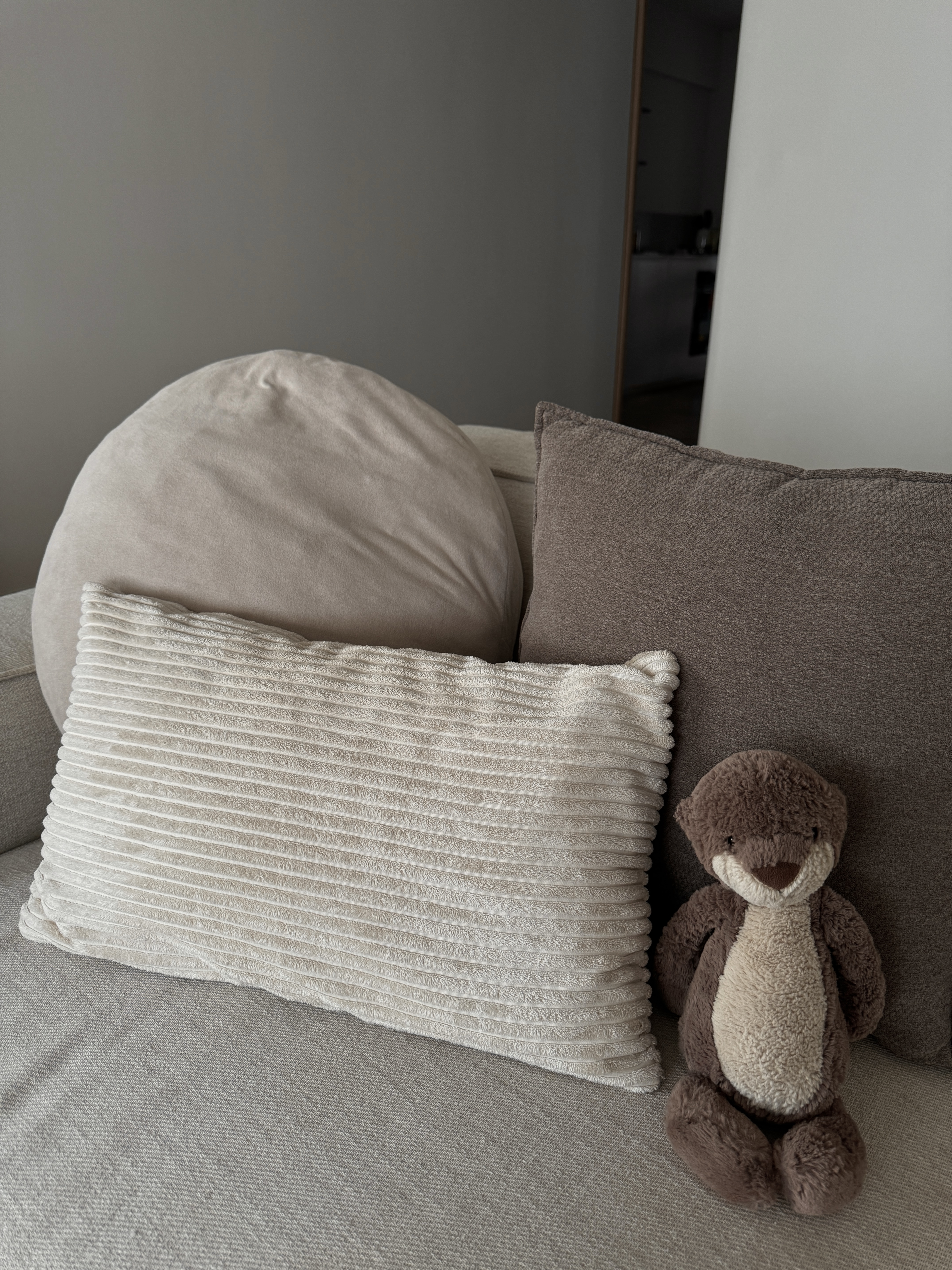 Home Styling: Tips to create a Cozy and Inviting Space - Soft, neutral-toned cushions, plush, beige and brown, cozy