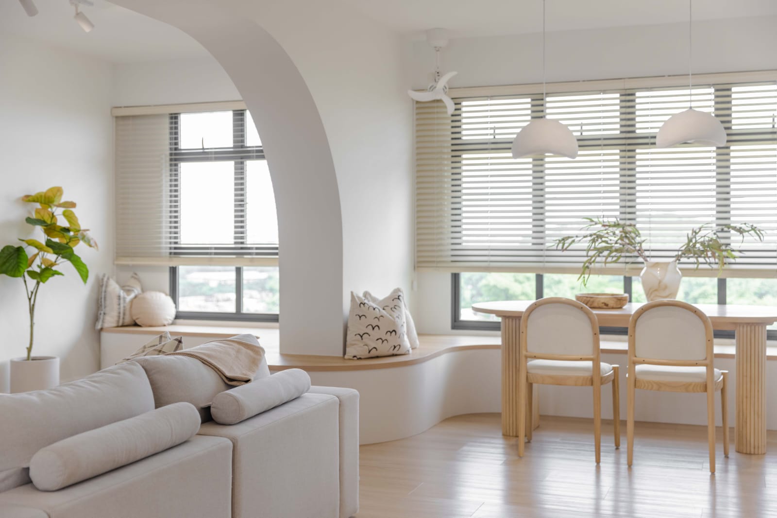 The Perfect Blend: Our Home Style Unveiled - Modern minimalist living room with large windows, soft natural light, neutral