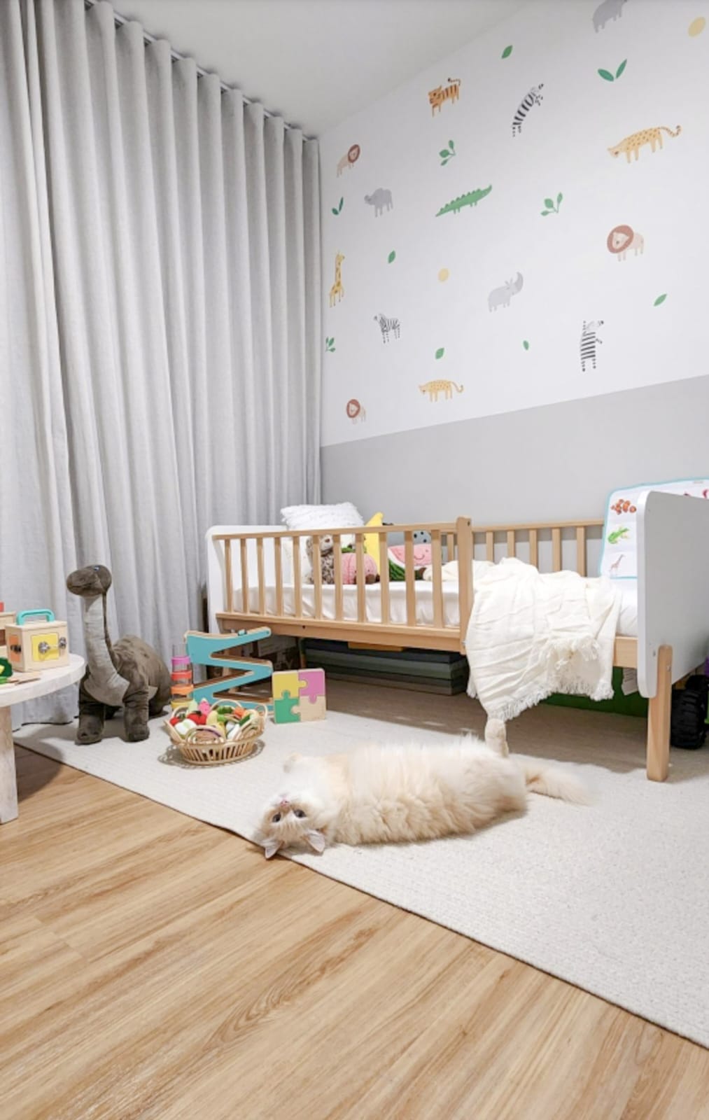 The Perfect Blend: Our Home Style Unveiled - Baby room, cozy nursery, soft blankets, wooden crib, white walls, giraffe