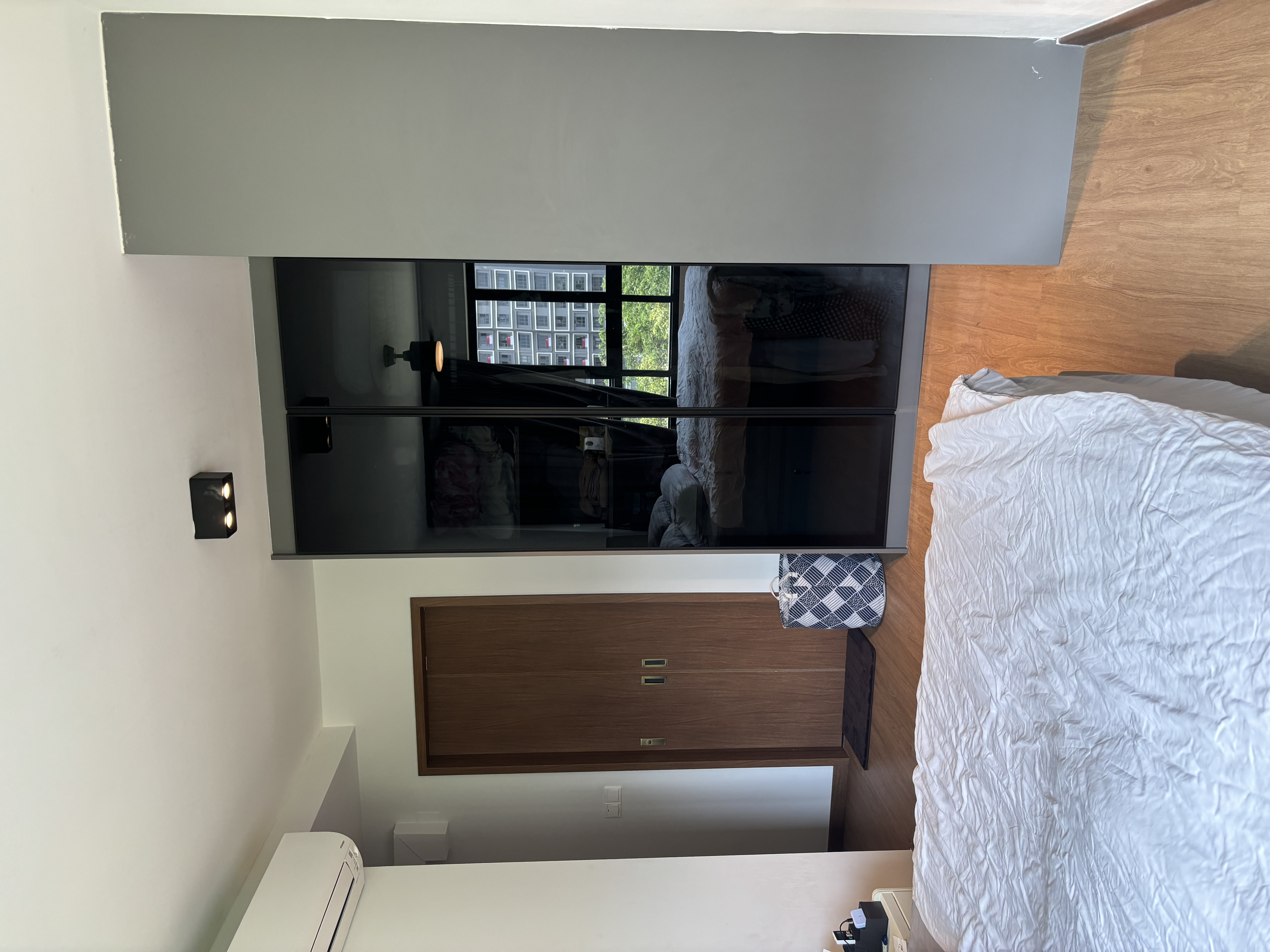 Cozy bedroom with muted tones  - Modern minimalist bedroom, white and gray color scheme, large window, wooden floor, textured