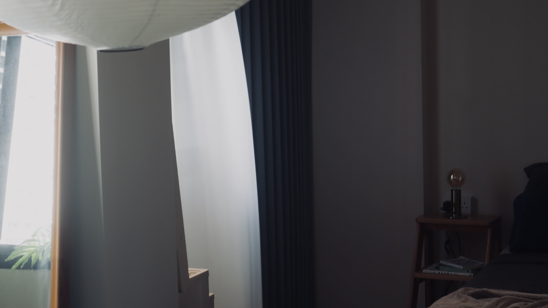 our "larger than life", master bedroom for two - Sunlight streaming through sheer curtains, soft shadows cast on the wall