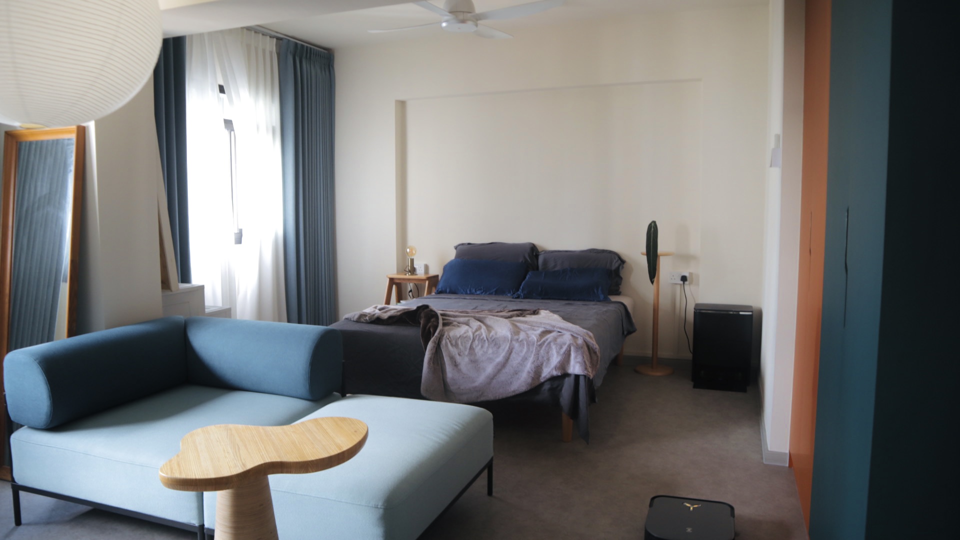 our "larger than life", master bedroom for two - Modern bedroom with blue and gray color scheme, cozy seating area with blue