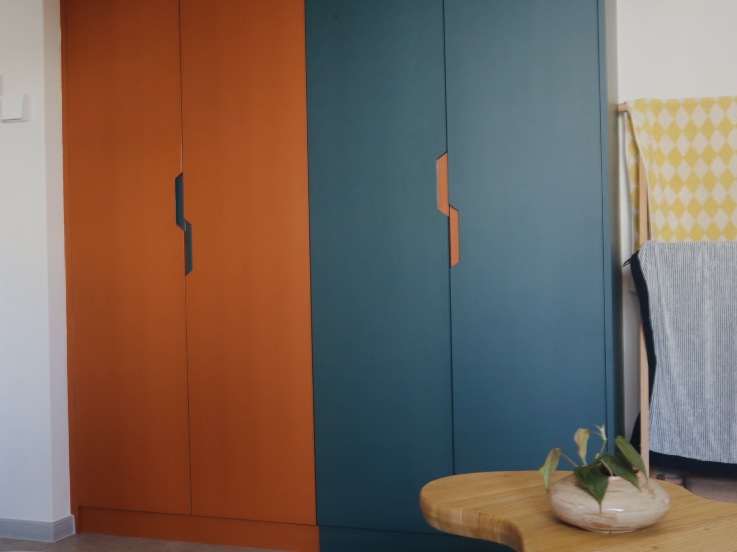 our "larger than life", master bedroom for two - modern interior, dual color scheme, orange and blue doors, minimalist