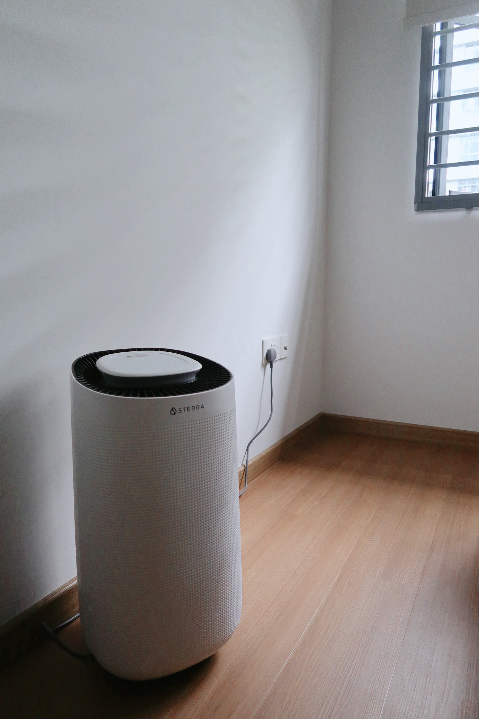 Snoozing off in our comfort Scandinavian bedroom  - Air purifier, white and black design, STERRA brand, modern design
