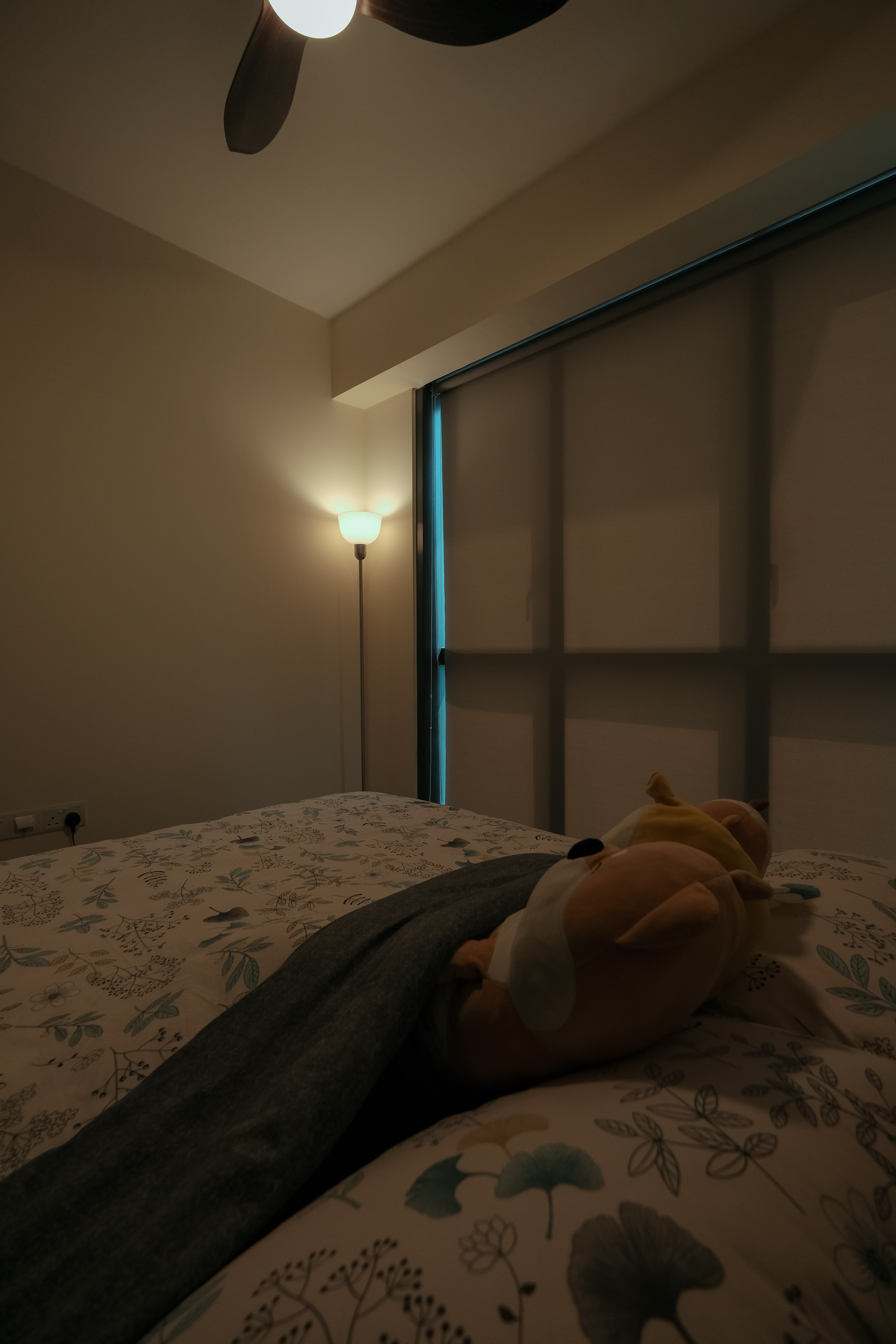 Embrace the simplicity and functionality of the bedroom!  - dimly lit bedroom, cozy atmosphere, soft lighting, bedside table