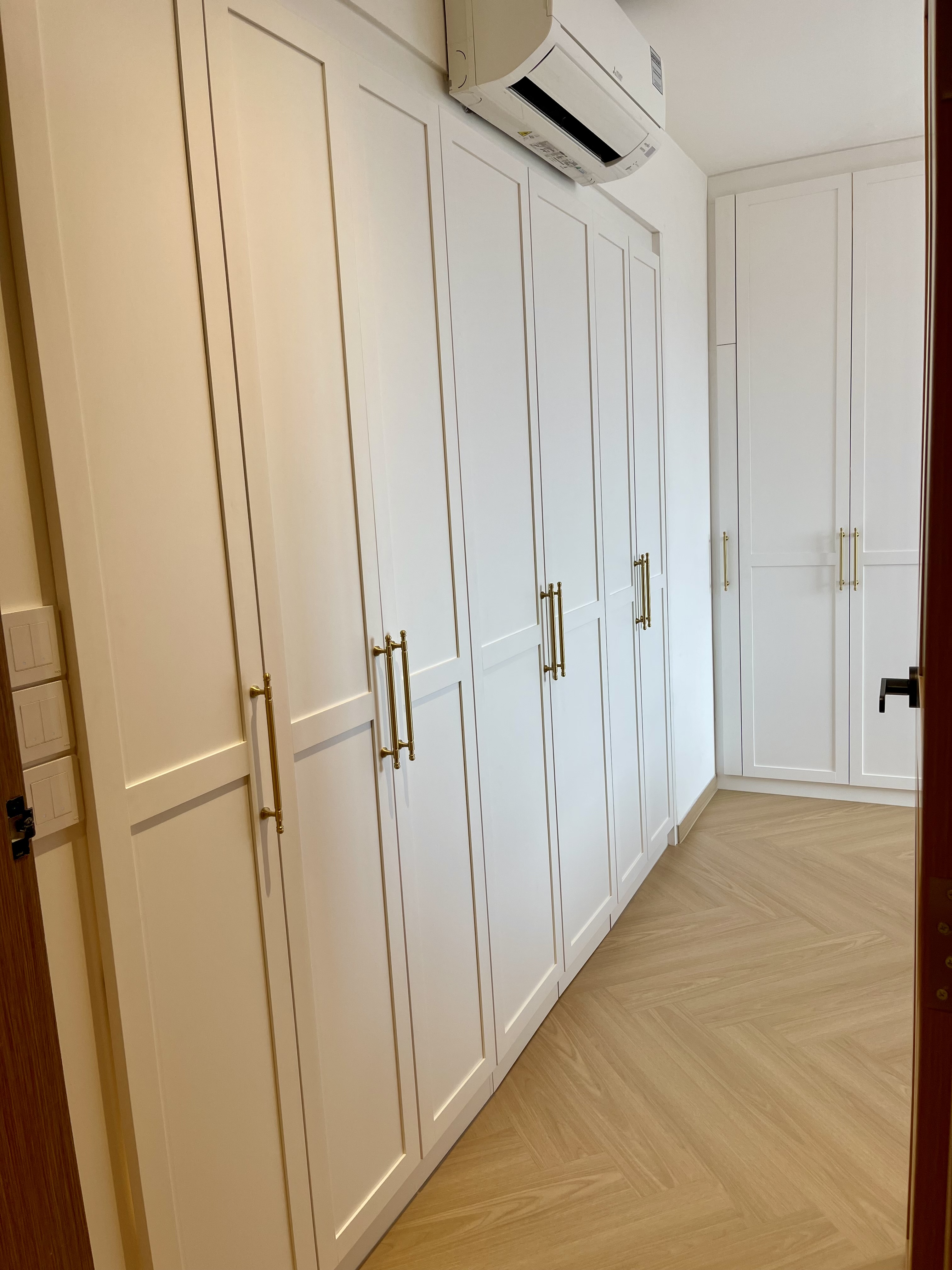 A Cosy Sanctuary: Our Slumber Haven With A Concealed Bathroom & Vanity - White kitchen cabinets, modern design, minimalist