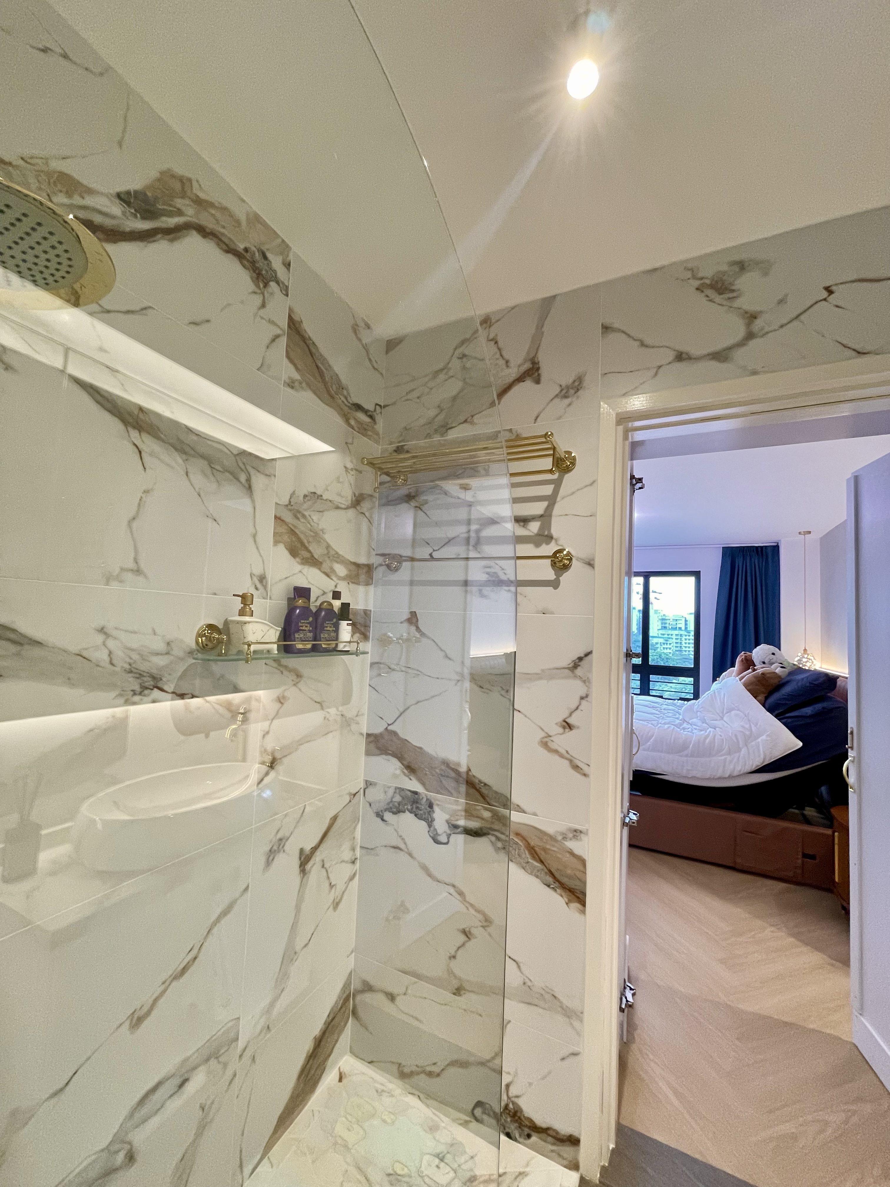 A Cosy Sanctuary: Our Slumber Haven With A Concealed Bathroom & Vanity - Marble-patterned bathroom, modern design, glass
