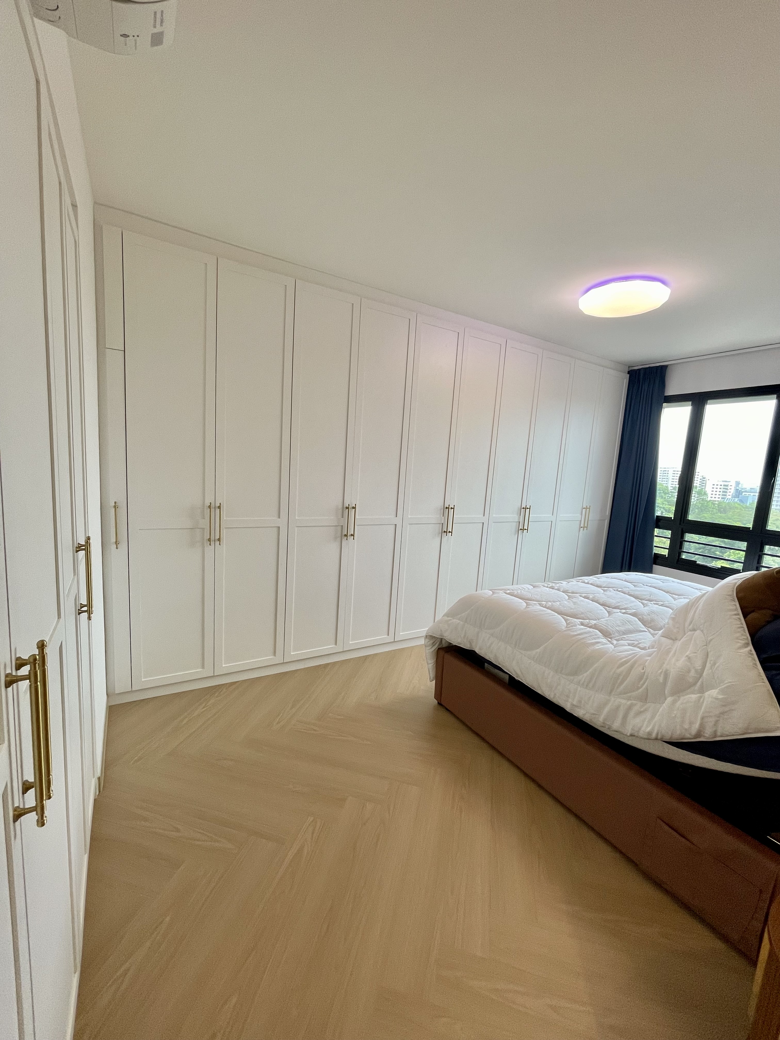 A Cosy Sanctuary: Our Slumber Haven With A Concealed Bathroom & Vanity - White cabinetry, wooden floor, modern design, large