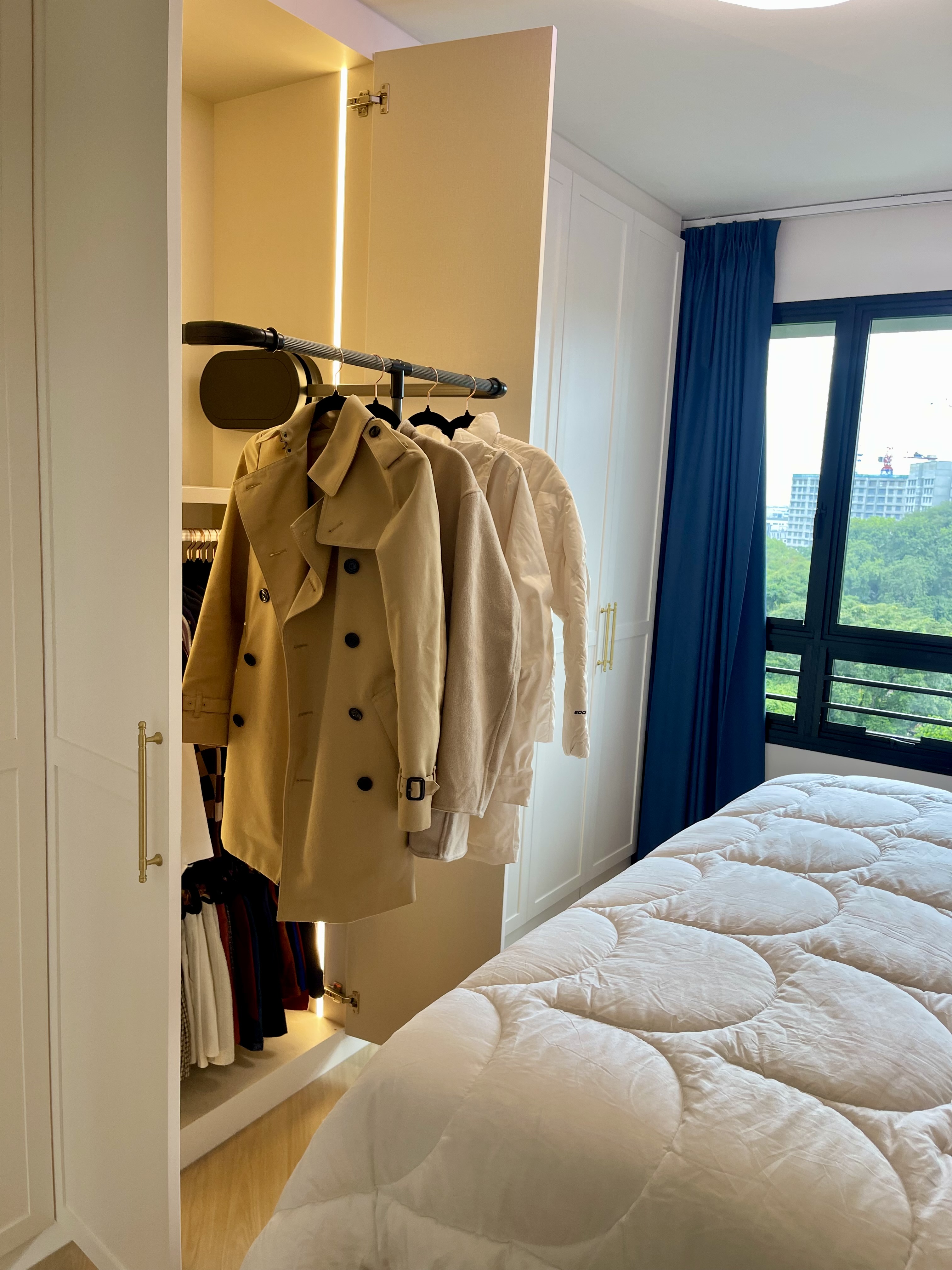 A Cosy Sanctuary: Our Slumber Haven With A Concealed Bathroom & Vanity - Mint green wardrobe with open doors, beige trench