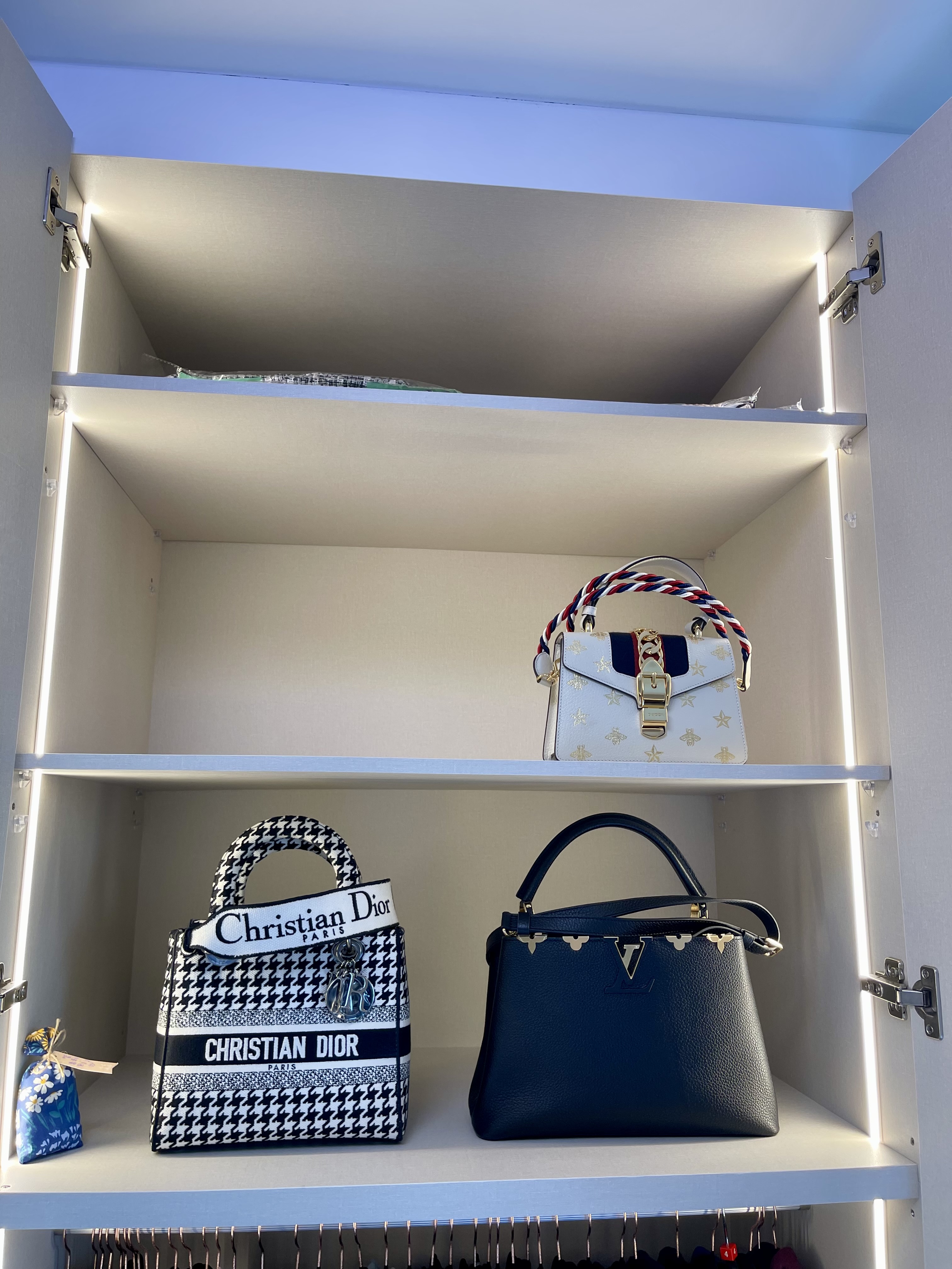 A Cosy Sanctuary: Our Slumber Haven With A Concealed Bathroom & Vanity - Shelf with neatly arranged designer bags, white and