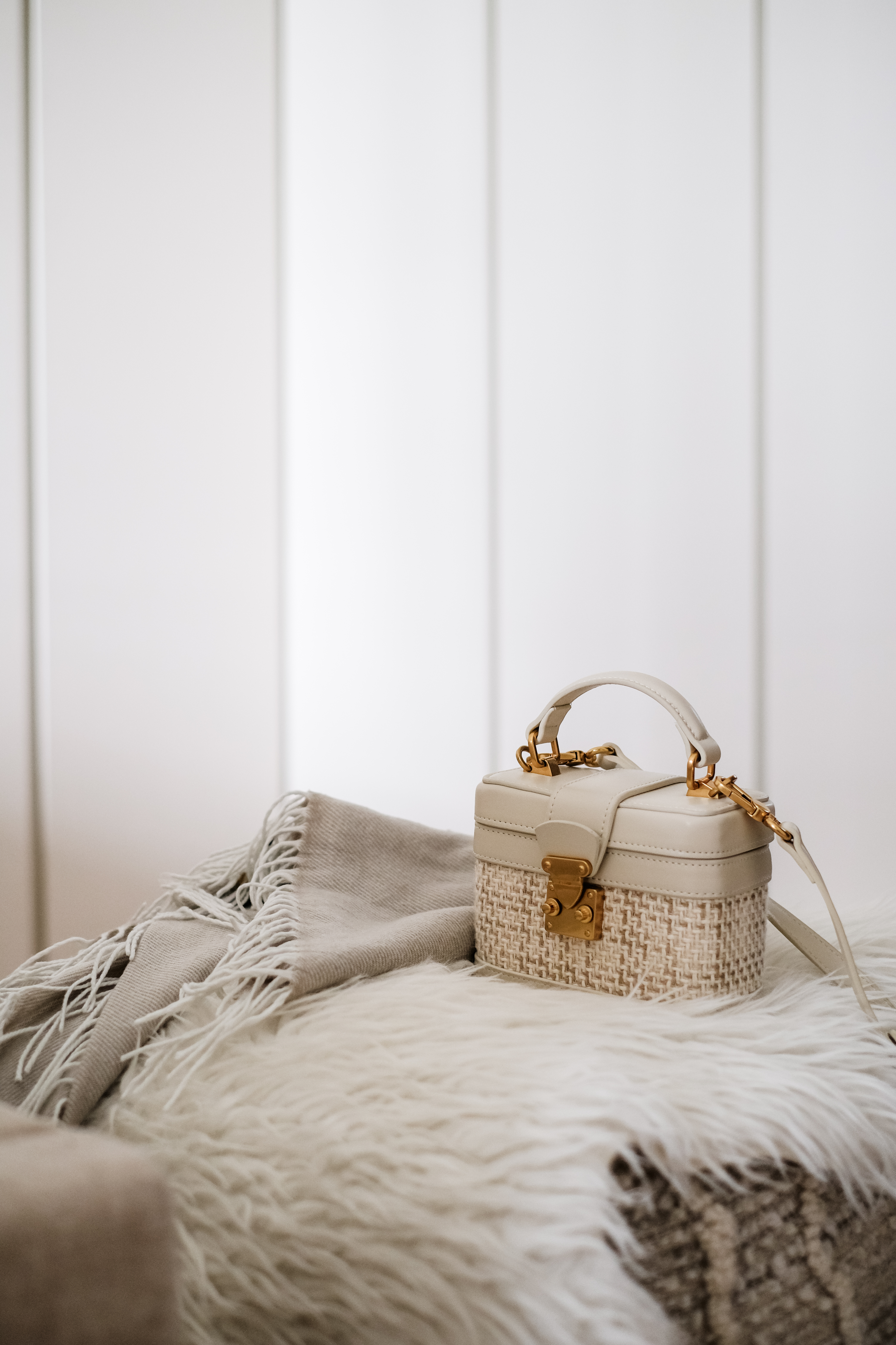 Calming Modern Bedroom in Creme Tones with DIY Wall Art - Handbag, beige, woven, gold hardware, fringe, textured fabric, soft