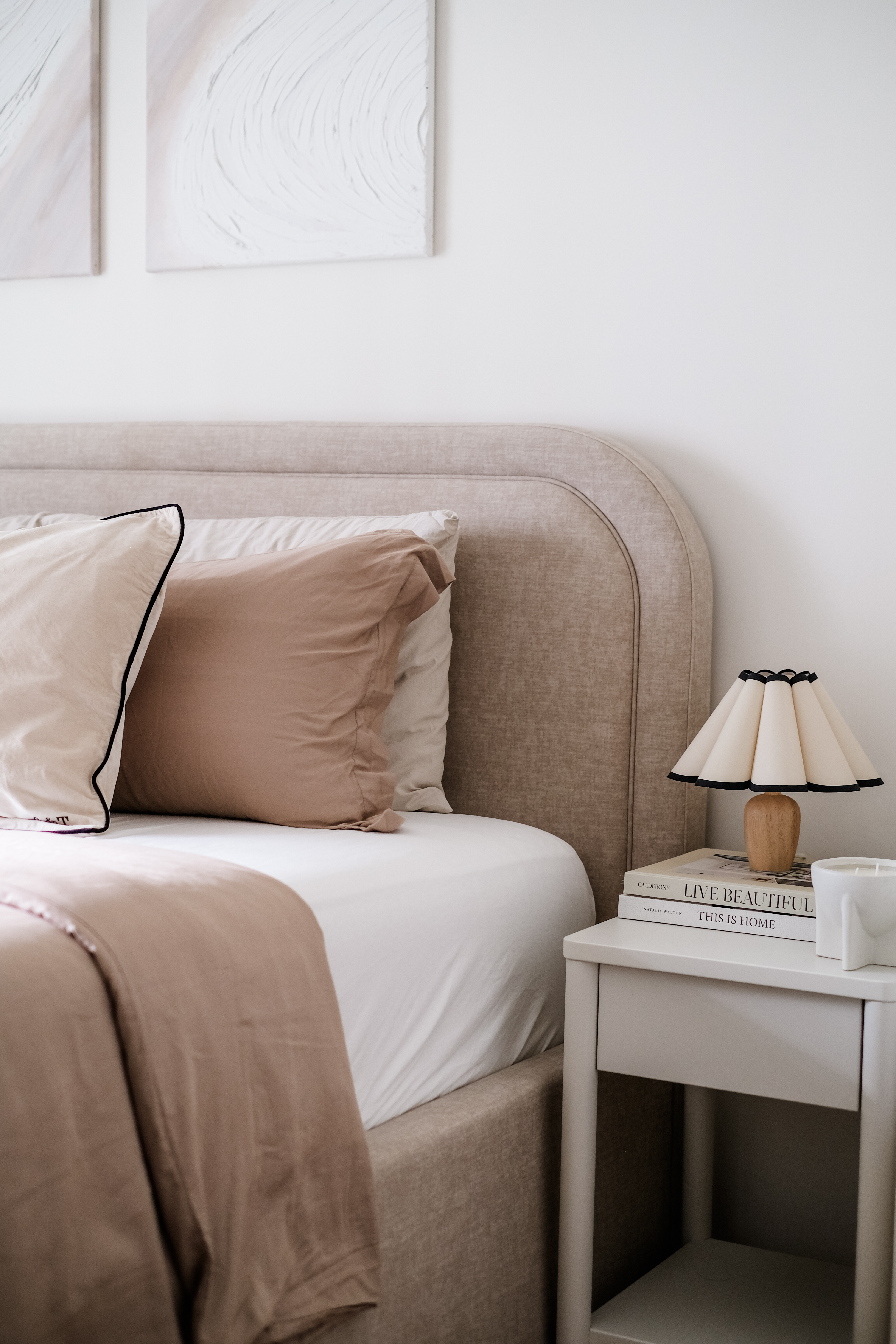 Calming Modern Bedroom in Creme Tones with DIY Wall Art - Cream and beige bedding, minimalist bedside table, modern lamp with