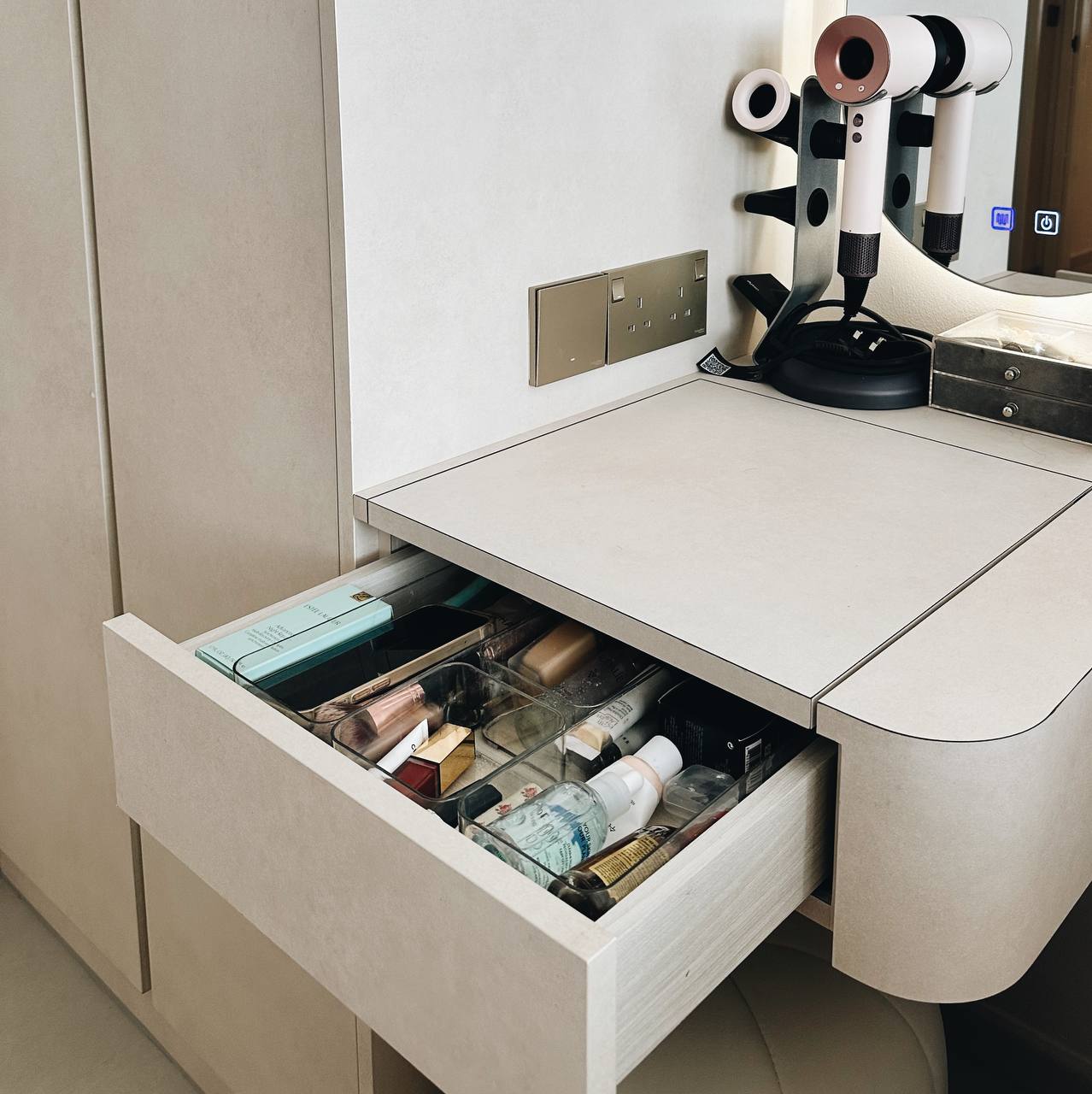 Our Bedroom: 5 Tips for a cozy, clutter-free bedroom!  - White vanity with open drawer, sleek design, modern bathroom