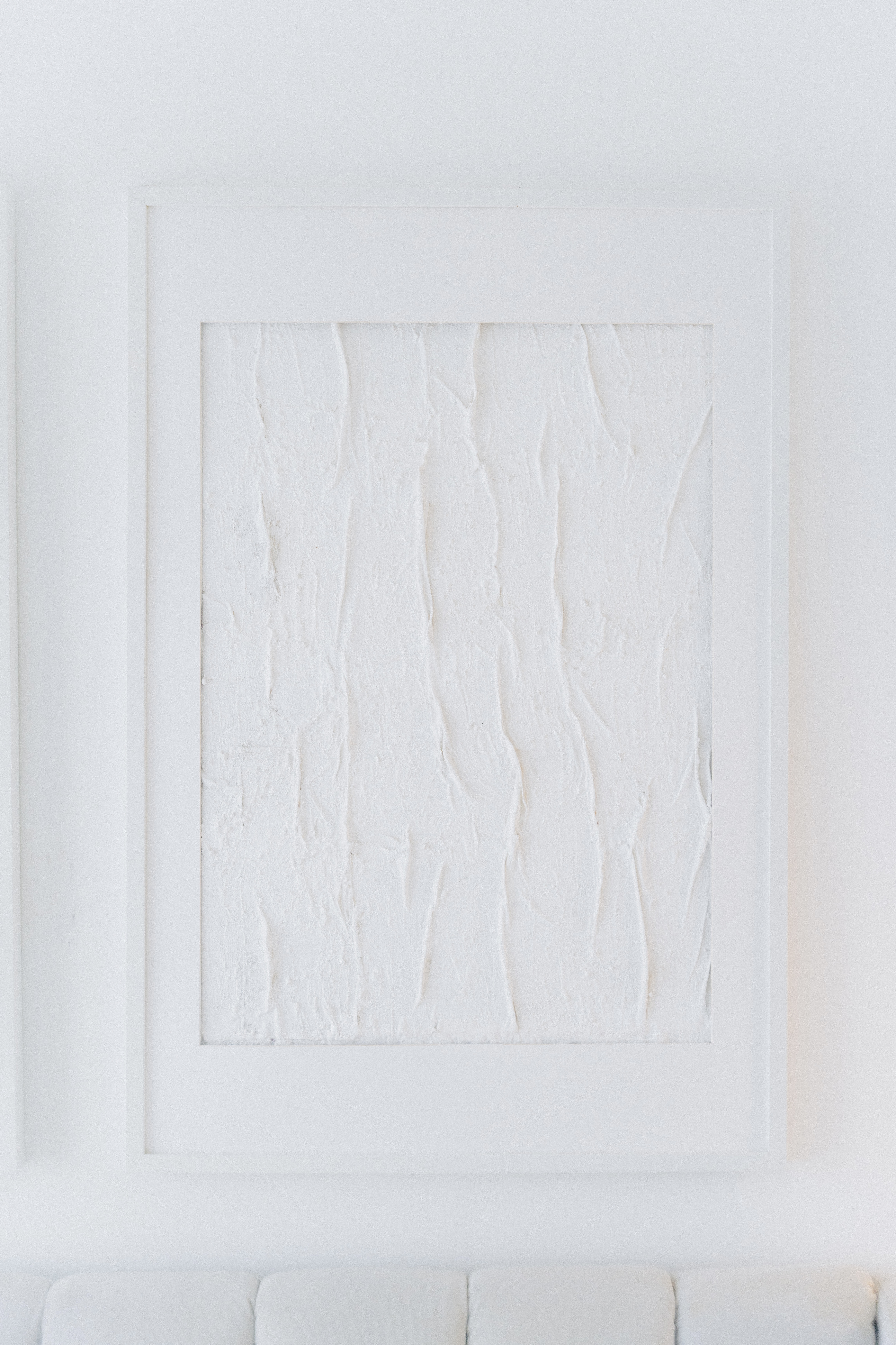 Our Bedroom: How We Changed It At Different Phases In Our Lives - White textured wall, minimalist art, framed picture