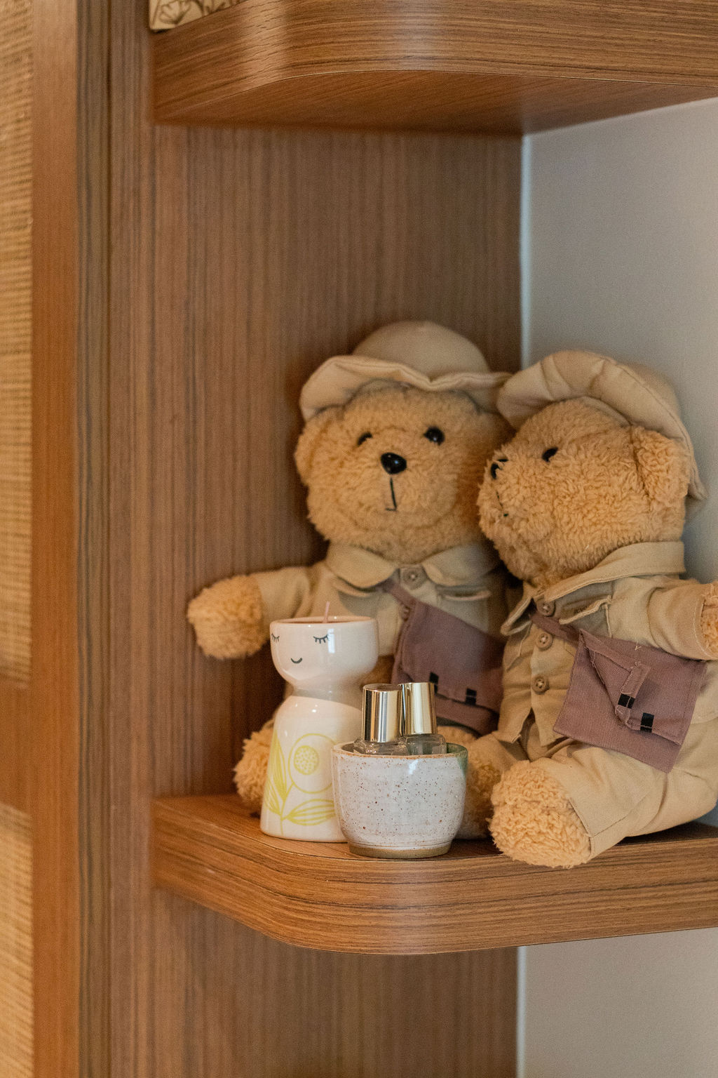 Home-Styling Tips: Achieving a cohesive island-living inspired home  - Teddy bears in beige, cozy outfits, sitting on wooden