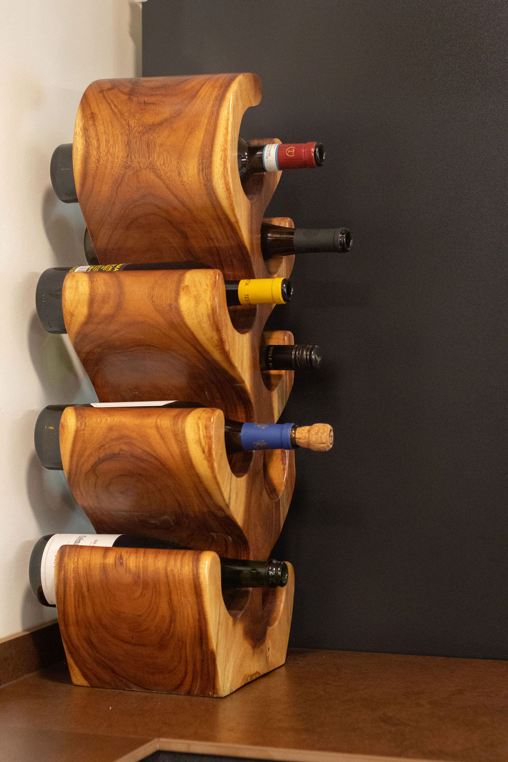 Home-Styling Tips: Achieving a cohesive island-living inspired home  - Wooden wine decanter holder, wine bottles, wine