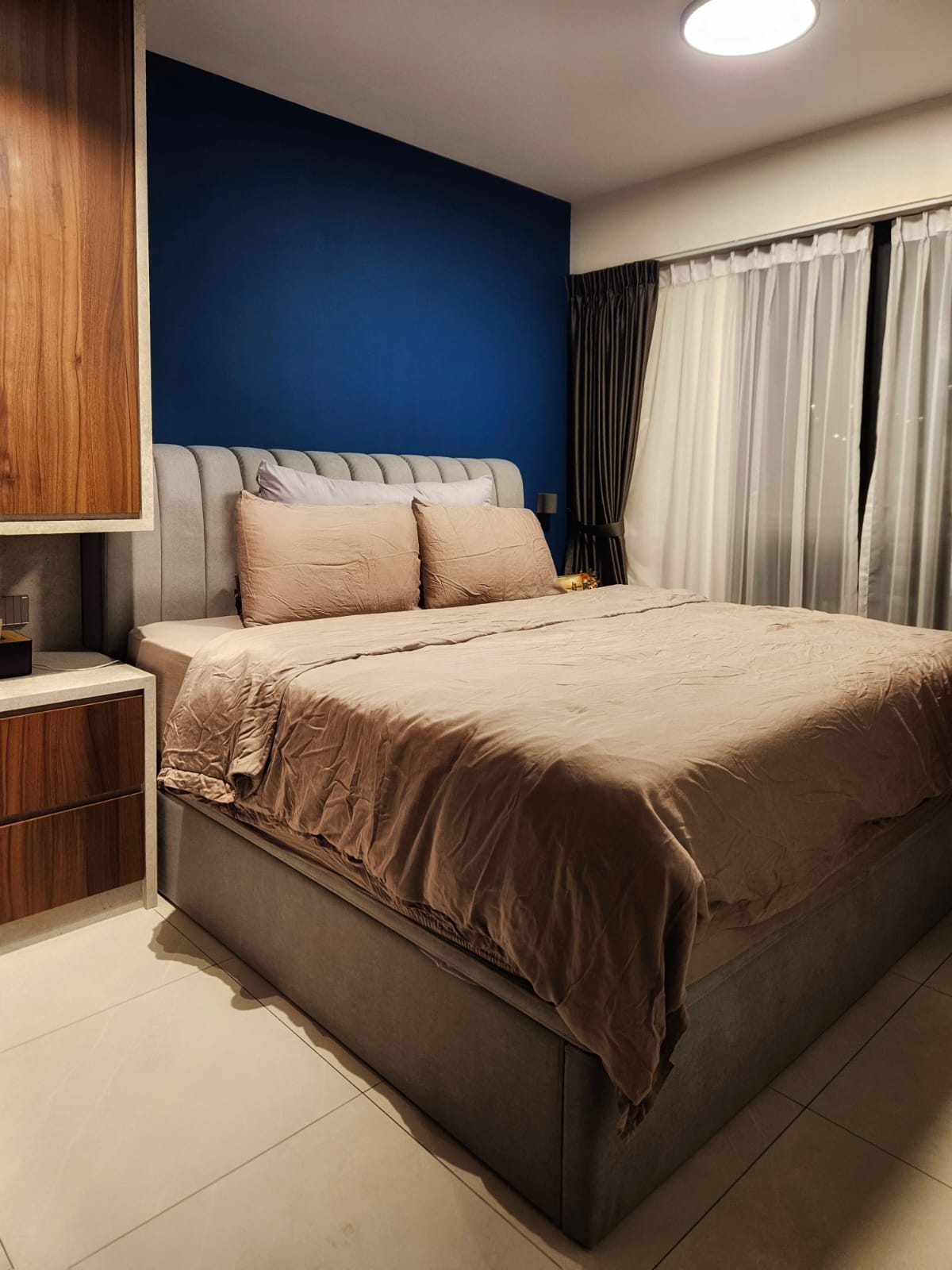 Stepping into elegance and tranquility with our blue feature wall! - Modern bedroom with blue accent wall, beige bedding