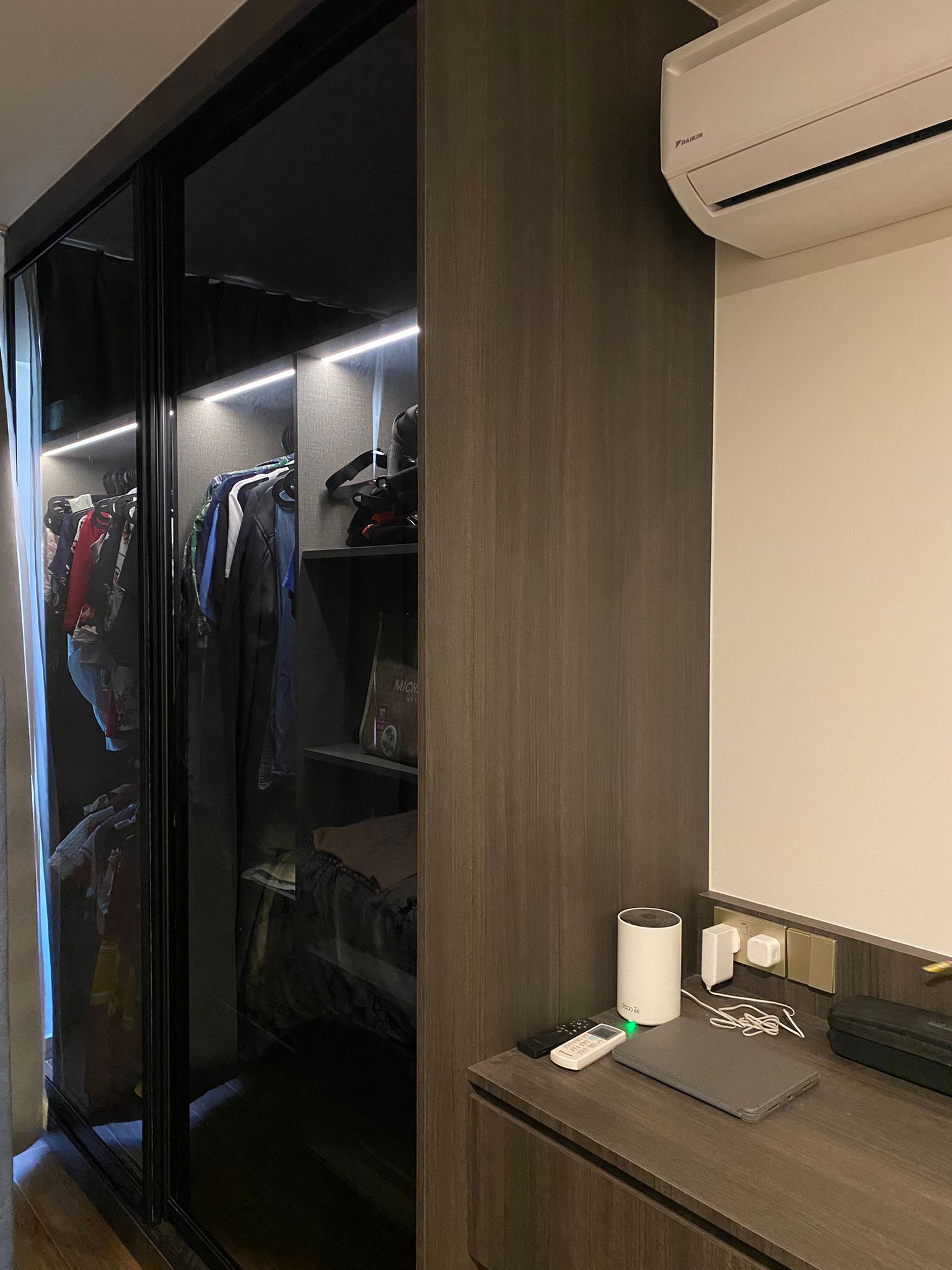 Integrating sleep and play for a space constrained 4-room BTO - Sleek, modern wardrobe with glass doors and built-in