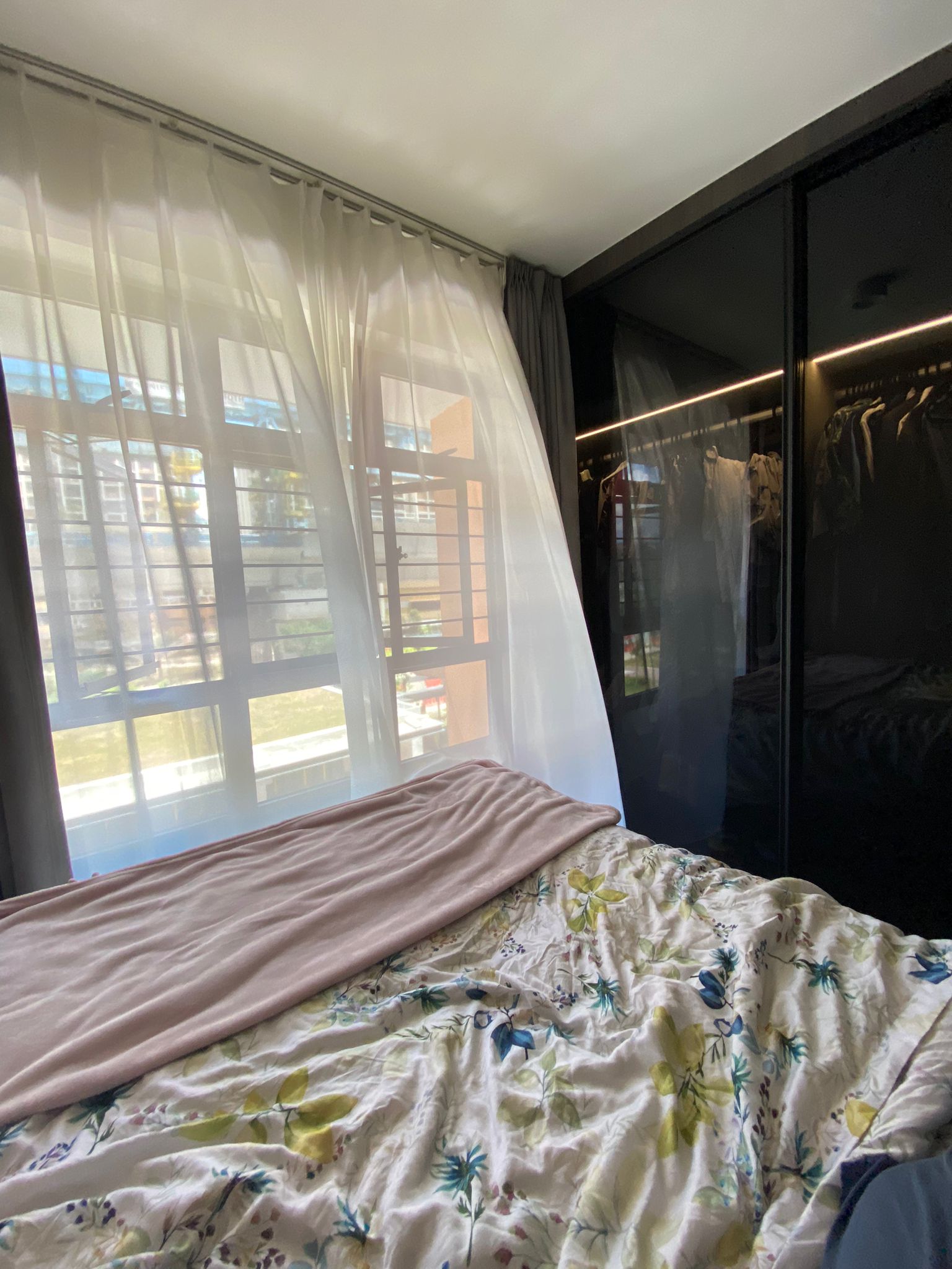Integrating sleep and play for a space constrained 4-room BTO - Sunlit bedroom with sheer curtains, floral-patterned