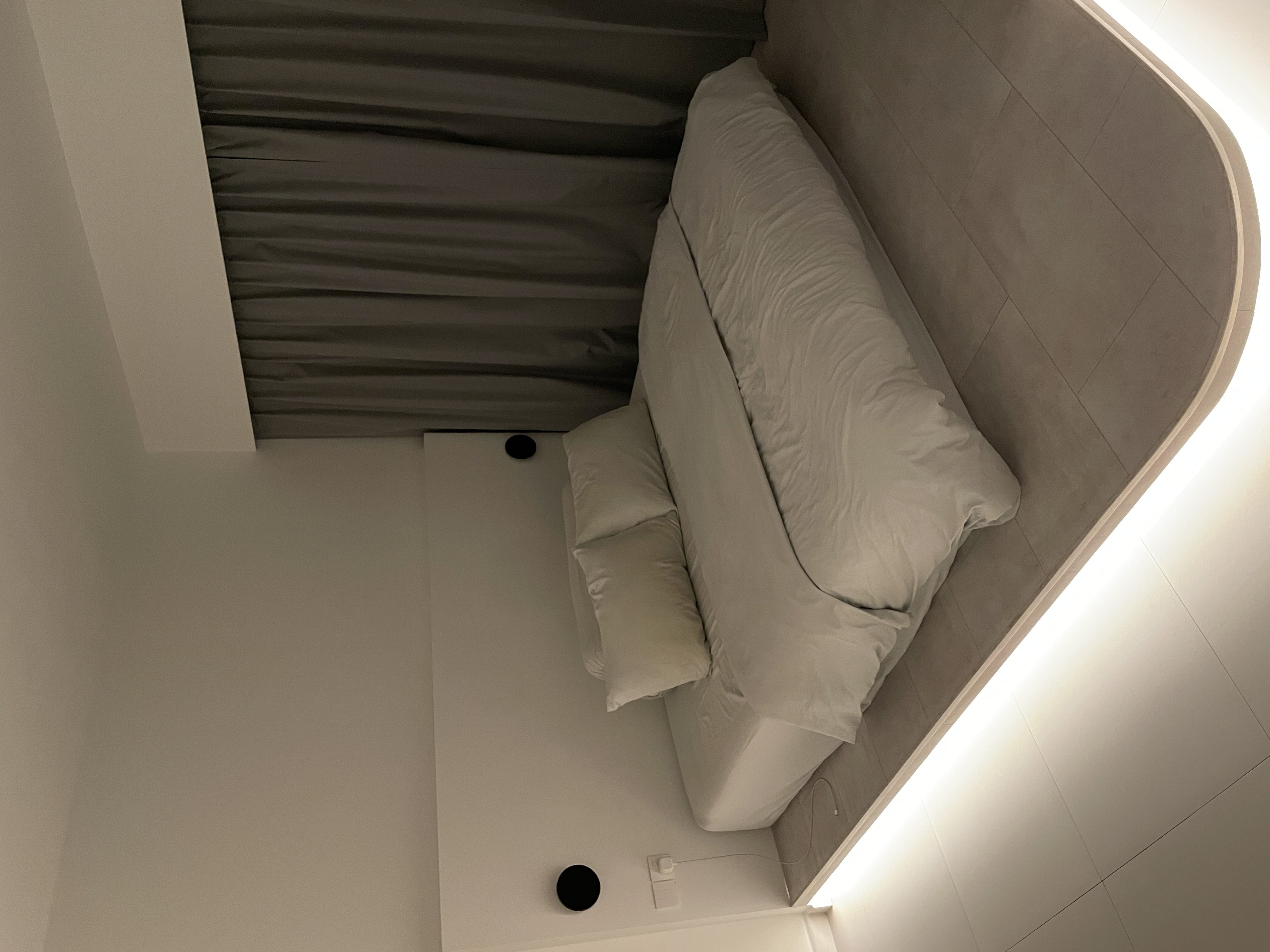 A Bedroom Haven: Curved Platform Bed with Plenty Wardrobe Spaces  - Modern minimalist bedroom, sleek design, contemporary