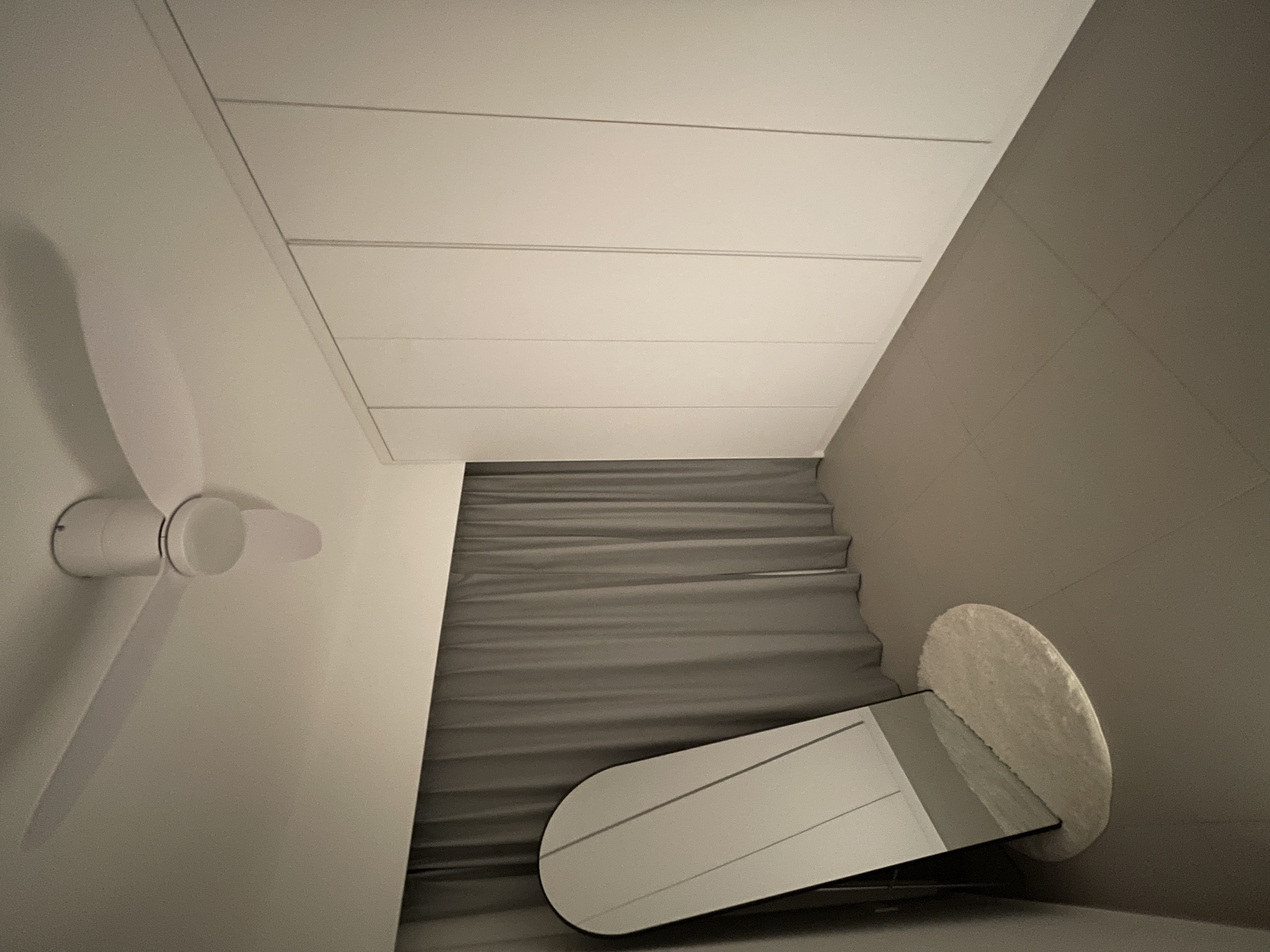 A Bedroom Haven: Curved Platform Bed with Plenty Wardrobe Spaces  - Step-stairs, minimalist design, modern aesthetic, sleek