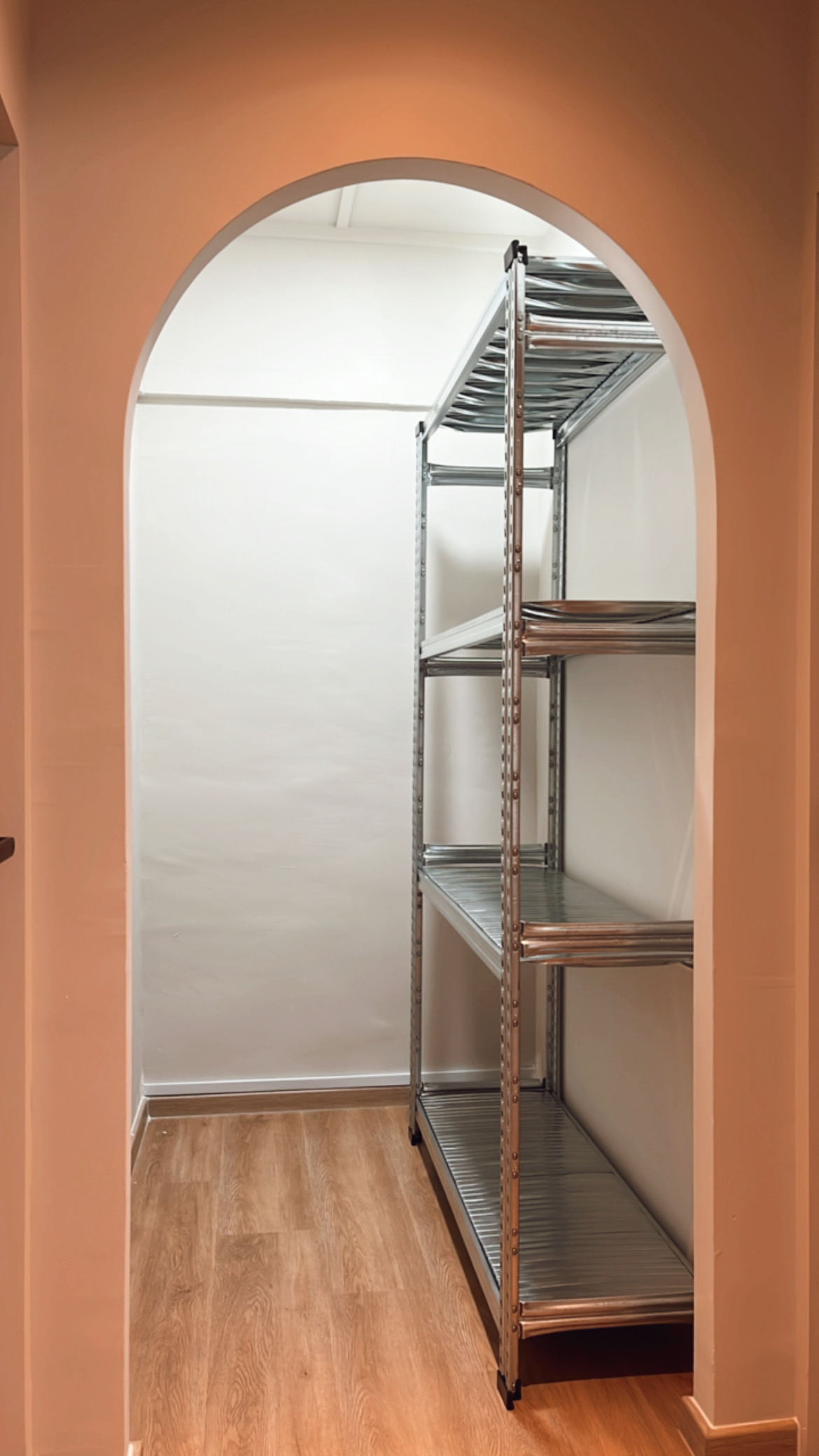 We spent $72k on our 4-Room HDB Renovation Journey - Metal shelving unit, arched doorway, white walls, wooden floor