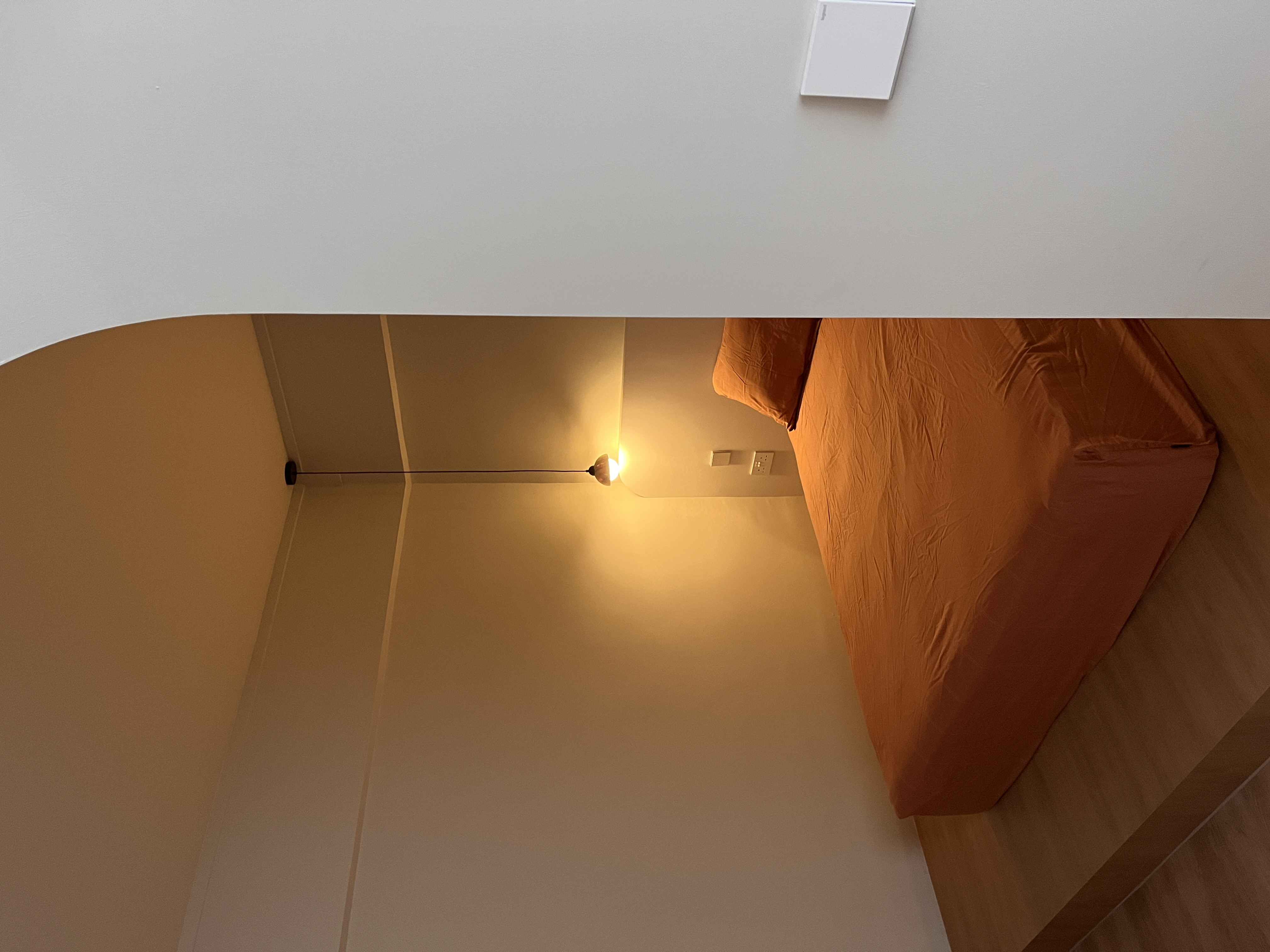 We spent $72k on our 4-Room HDB Renovation Journey - Modern minimalist bedroom, cozy bed, orange comforter, soft lighting