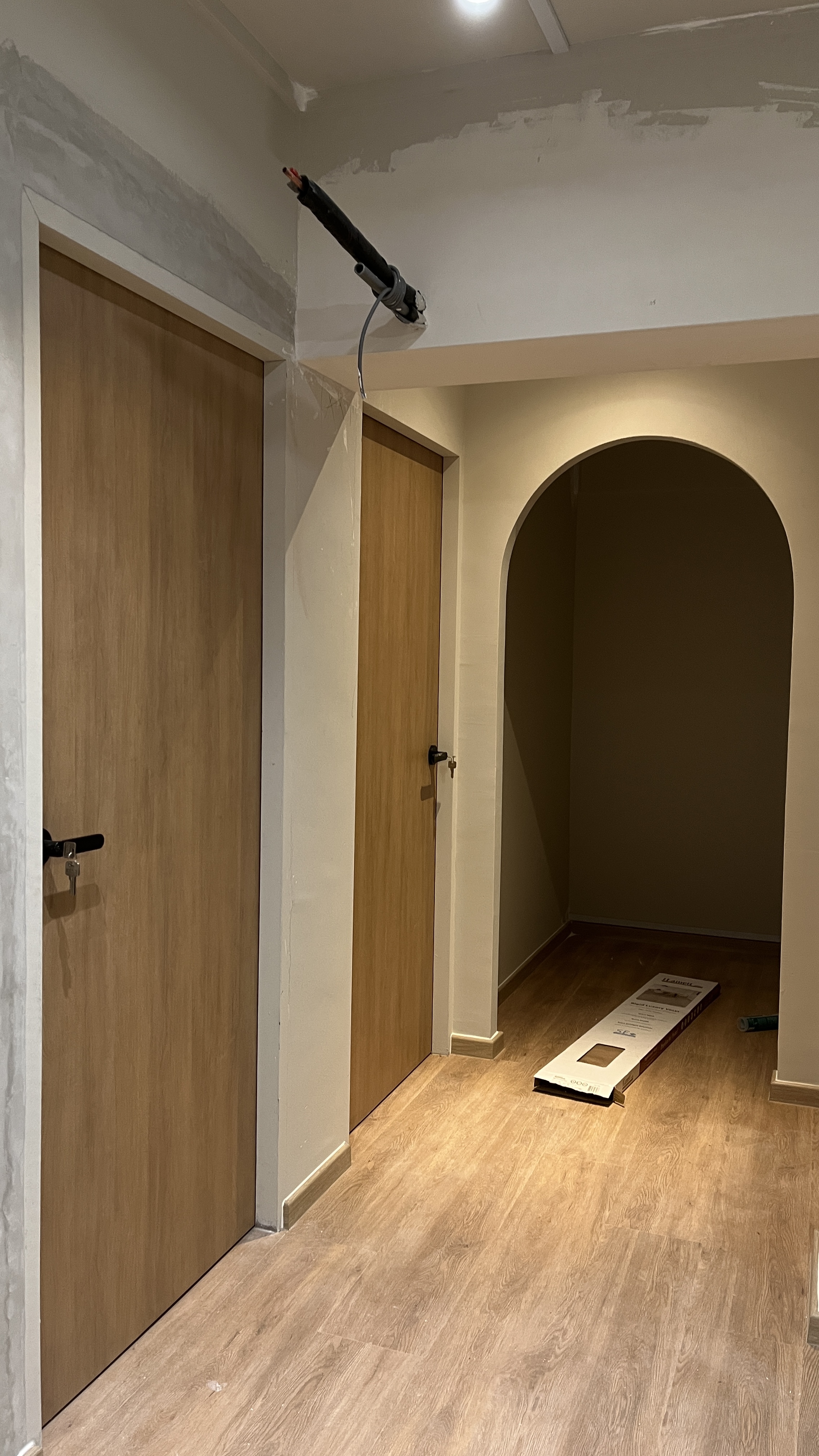 We spent $72k on our 4-Room HDB Renovation Journey - Wooden doors, unfinished walls, wooden floor, archway, ceiling, light