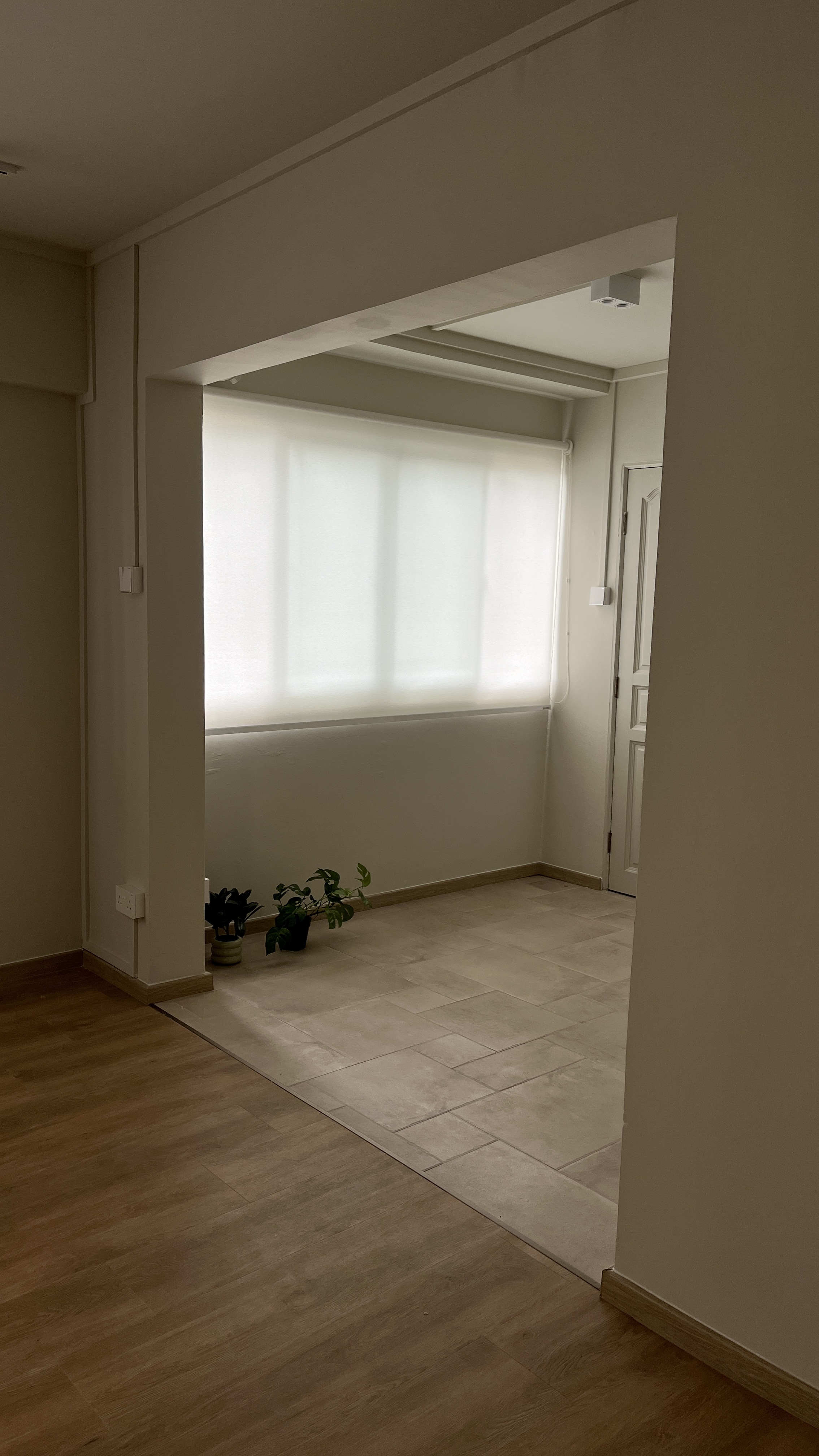We spent $72k on our 4-Room HDB Renovation Journey - Light-filled room with beige walls, wooden floor, large window with